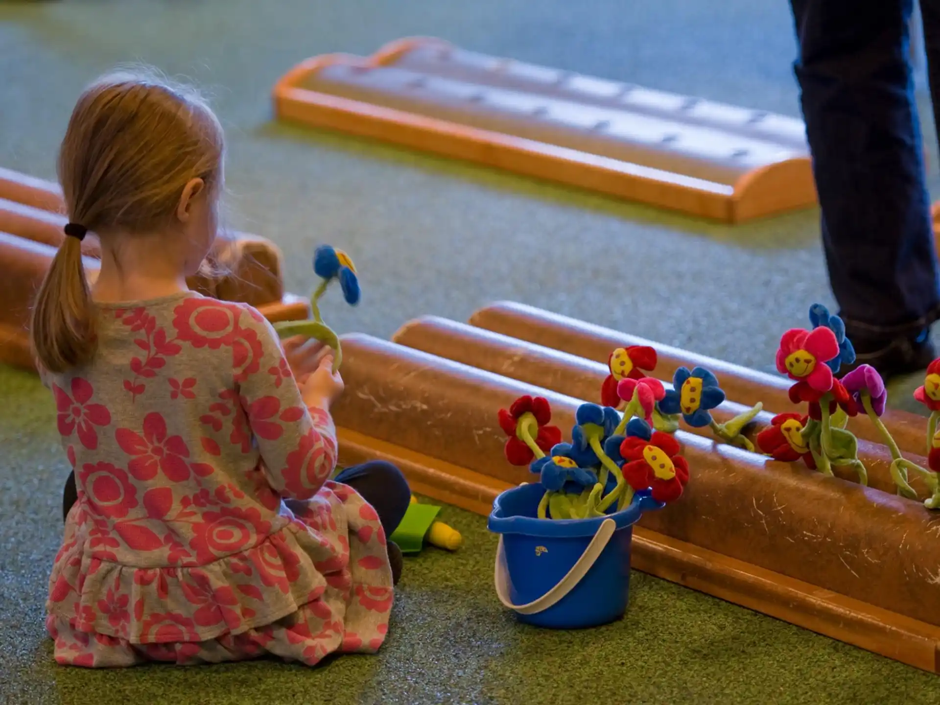 a girl playing with a toy