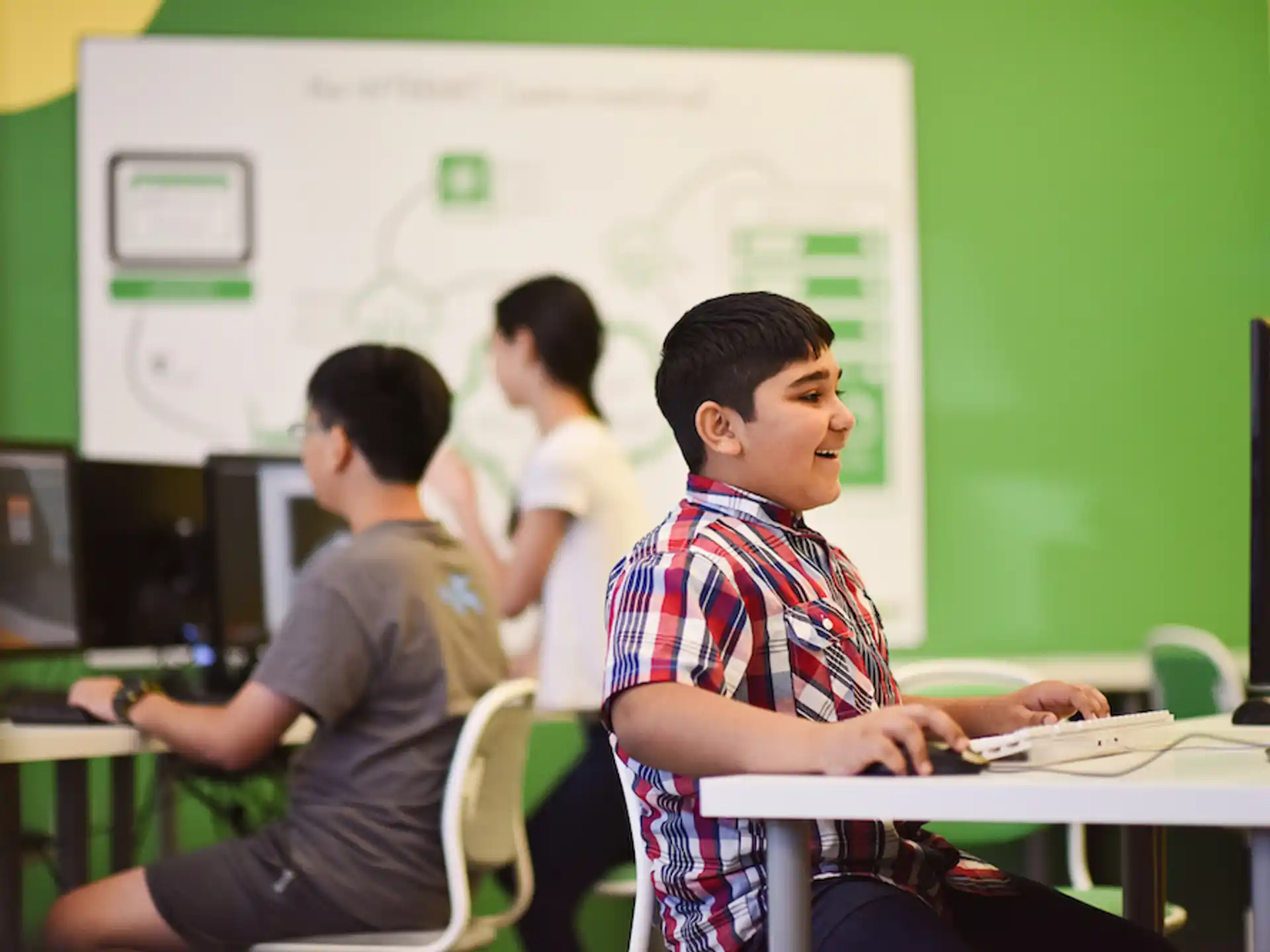 a few young men working on computers