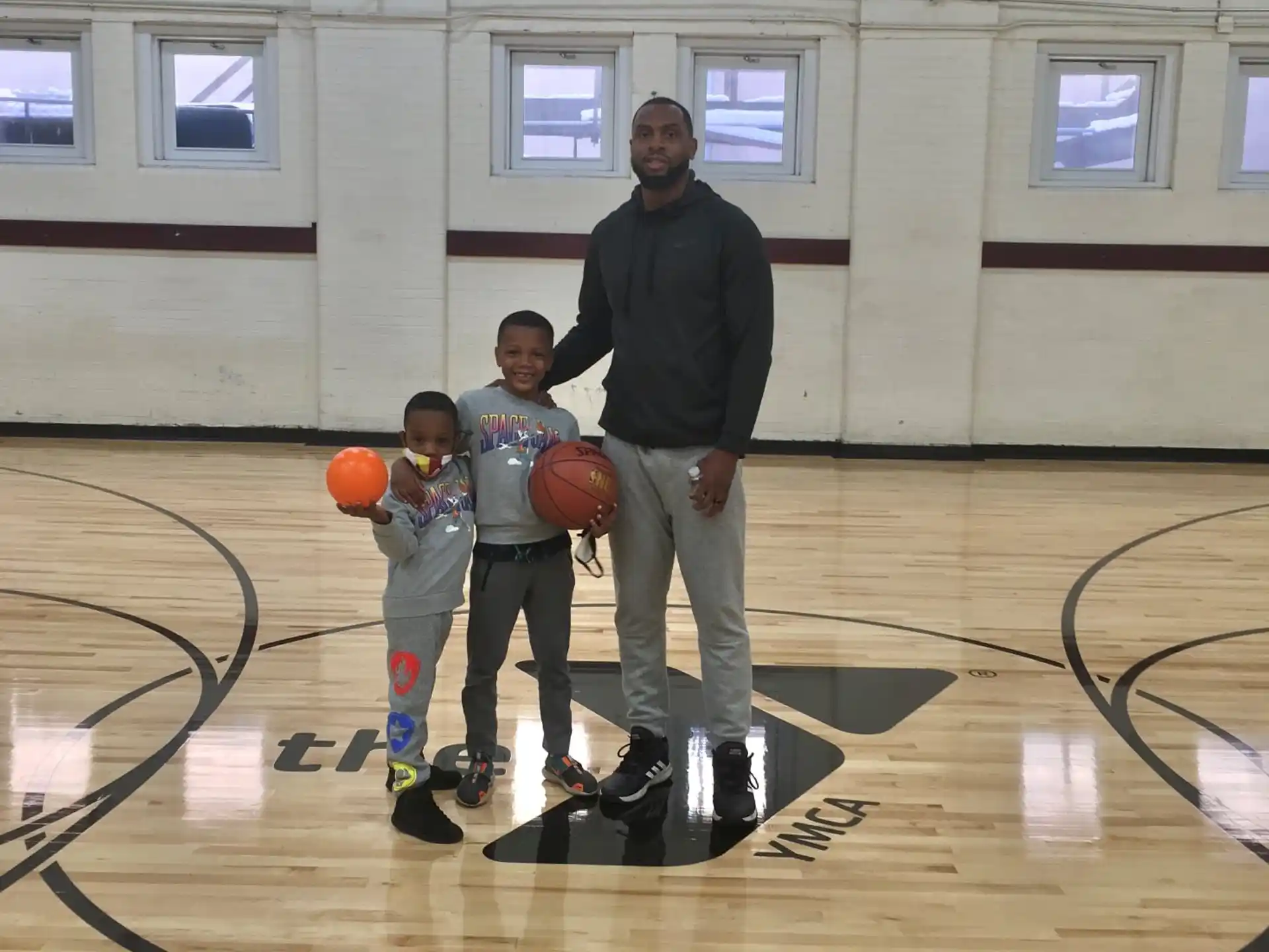 a group of people on a basketball court