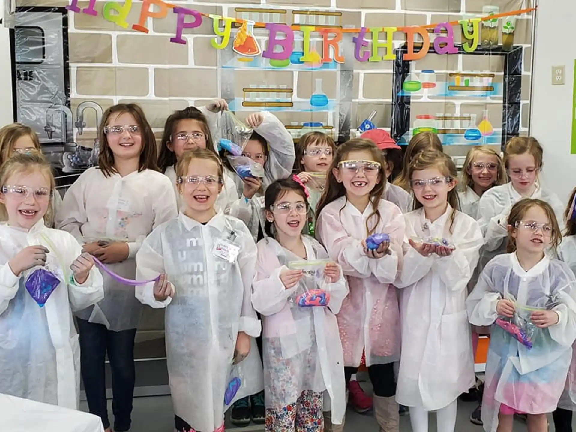 a group of women in white lab coats
