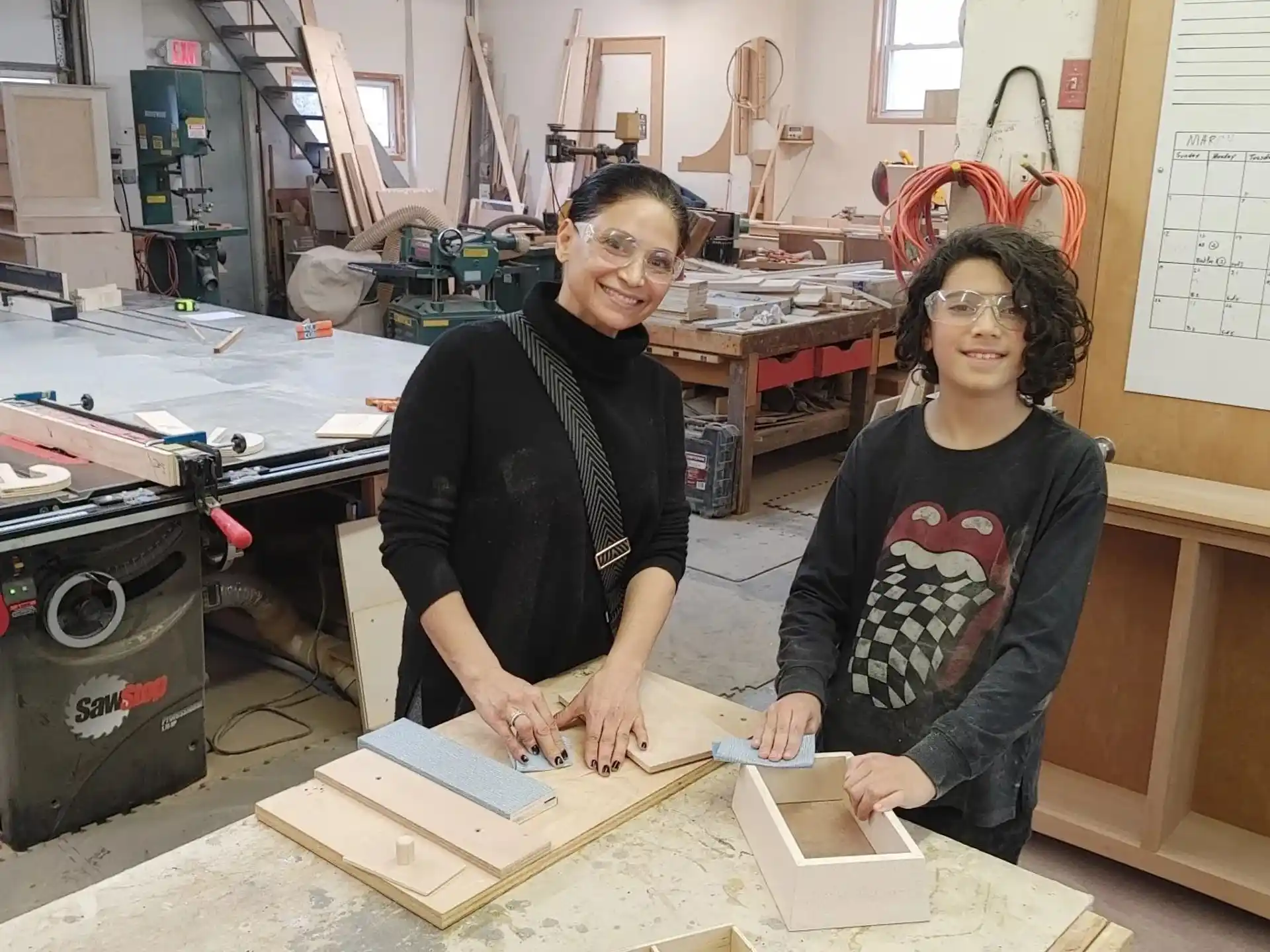 a couple of women in a workshop