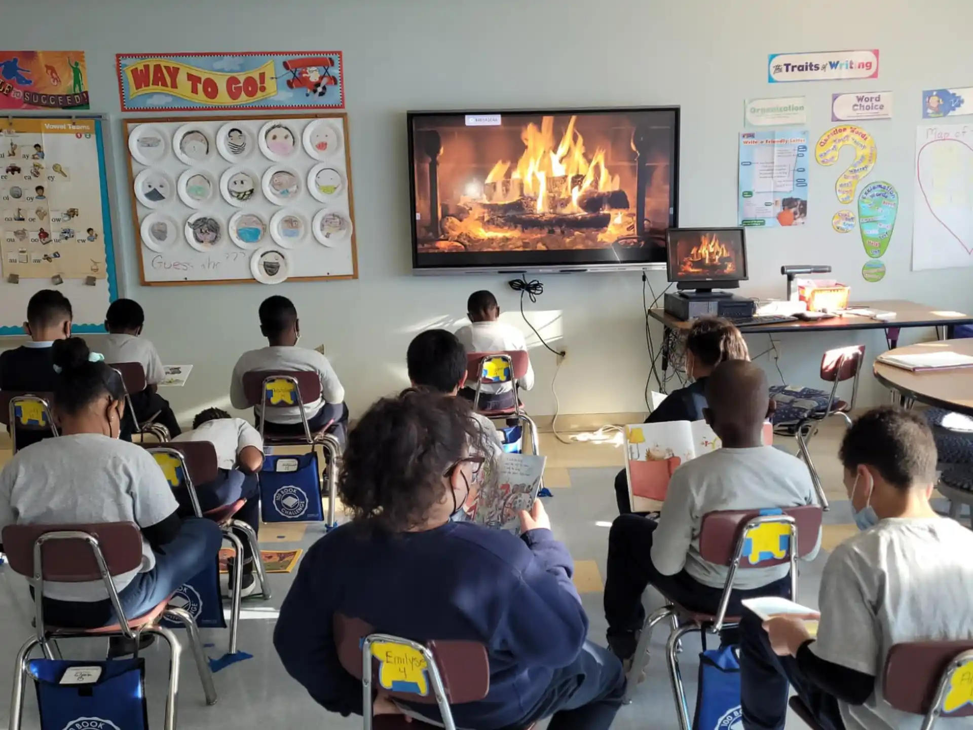 a group of people sitting in a classroom