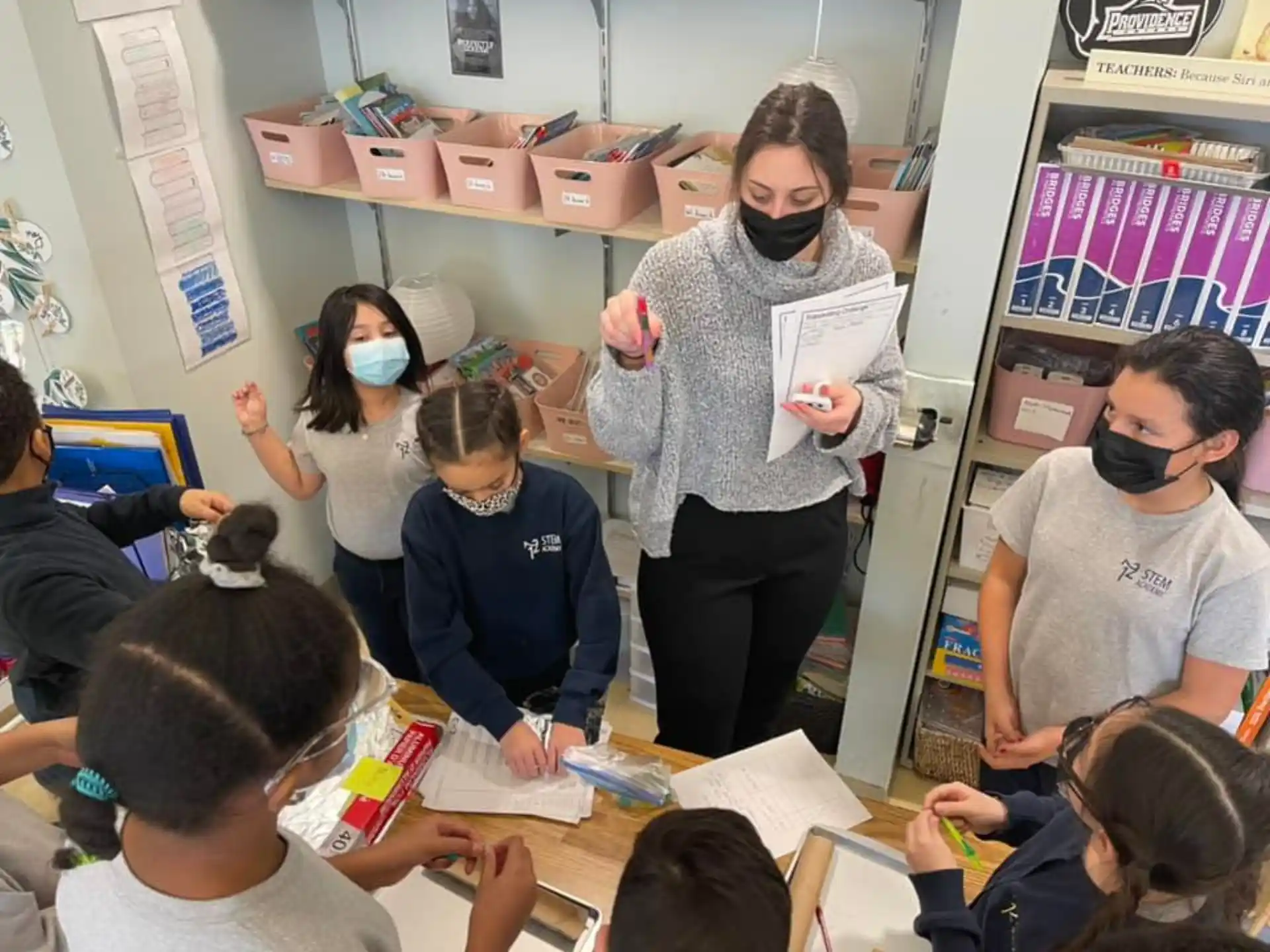 a teacher teaching a group of students