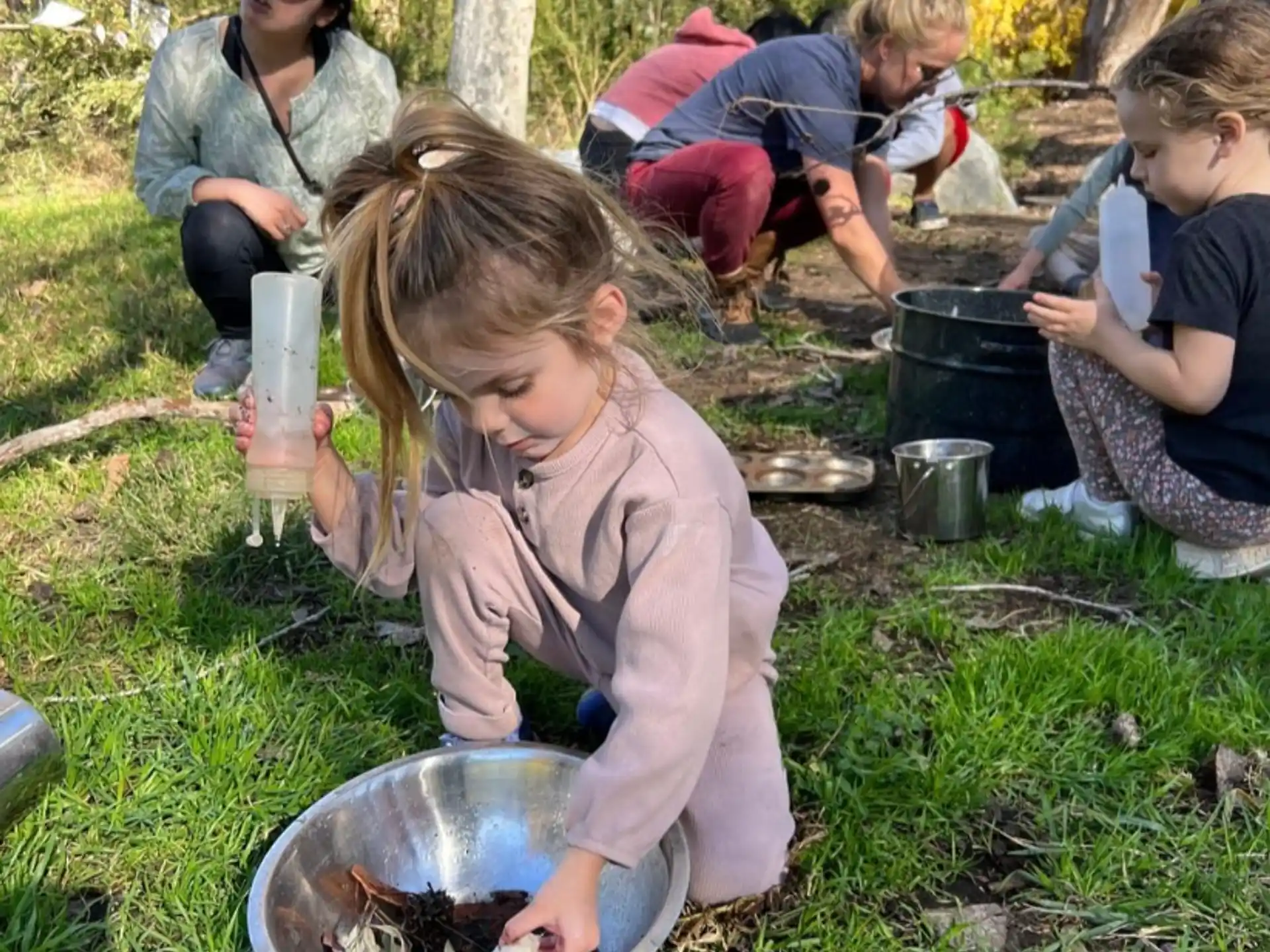 a group of people cooking outside