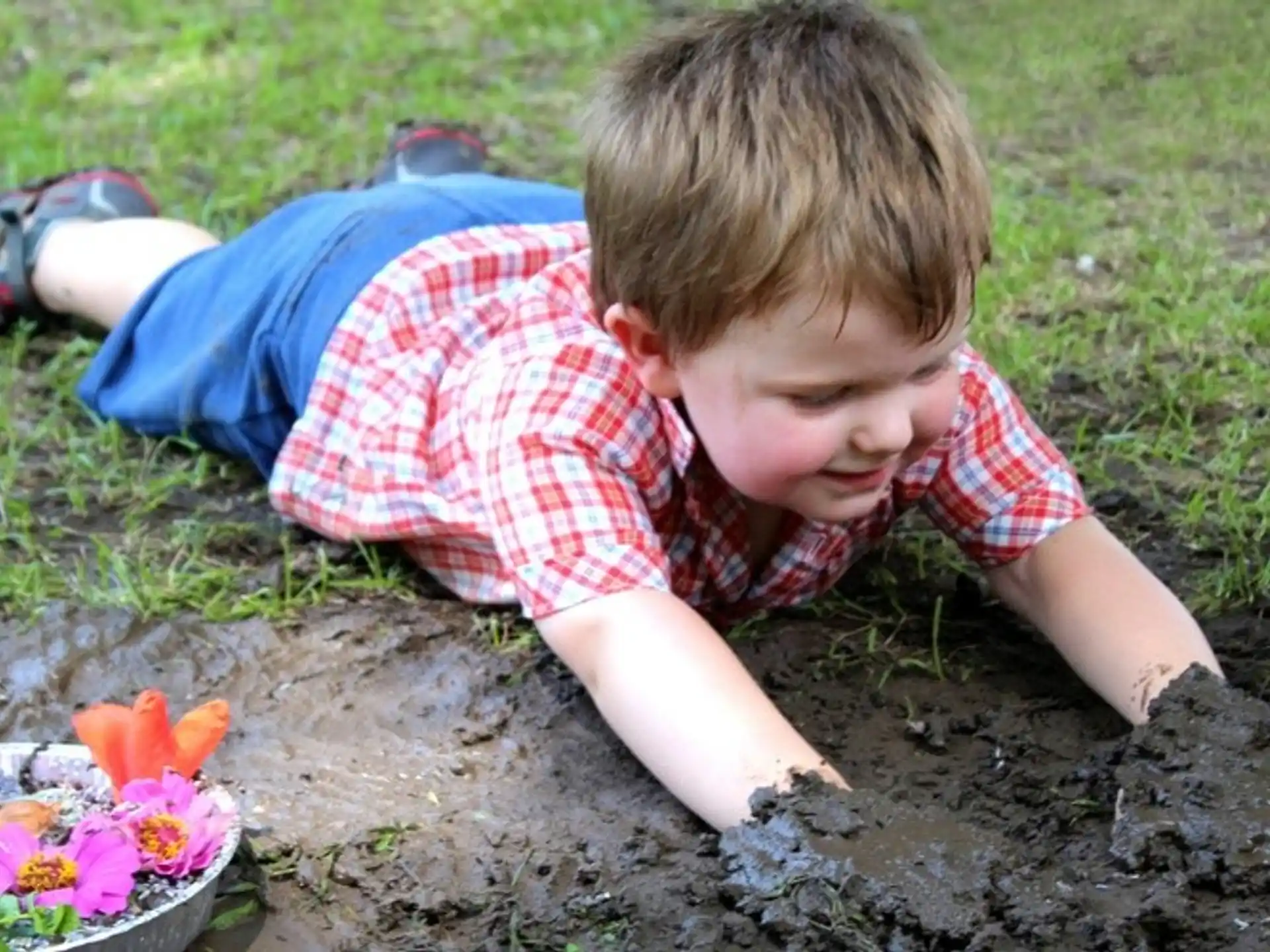 a child playing with flowers