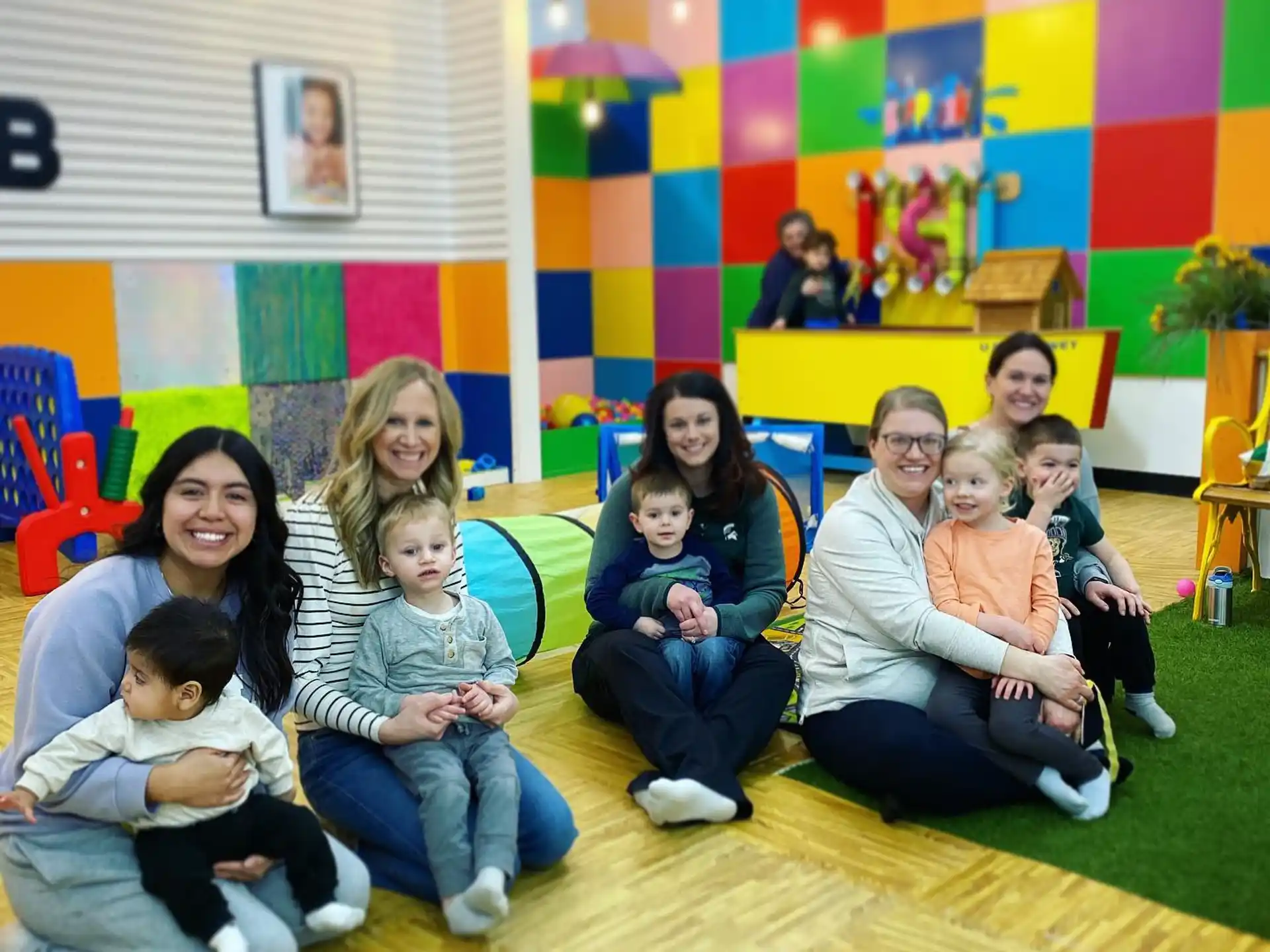 a group of people sitting on the floor