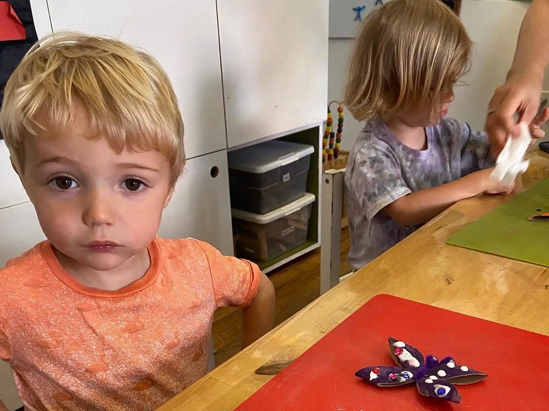 a boy sitting at a table