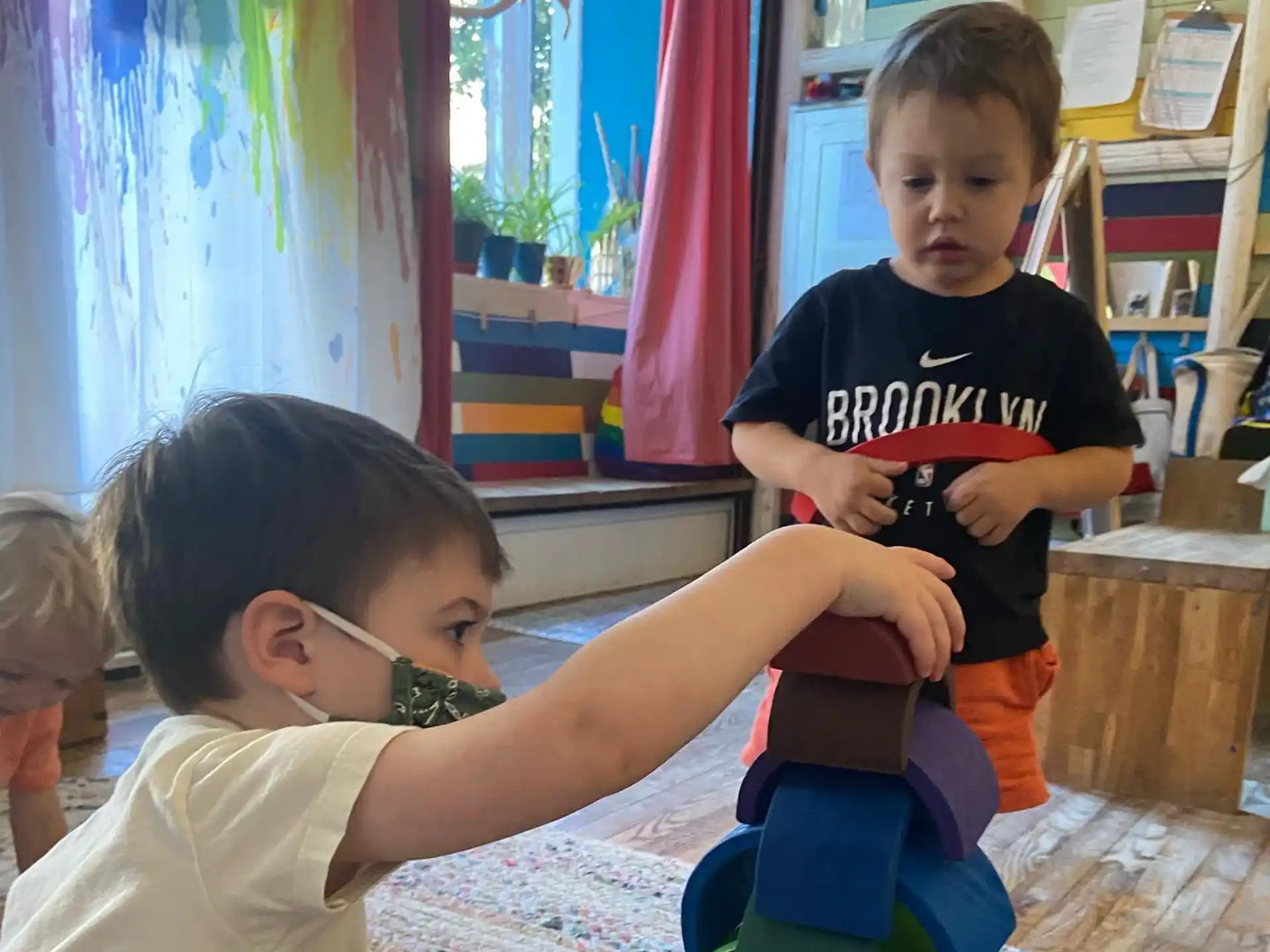 a couple of children playing with toys