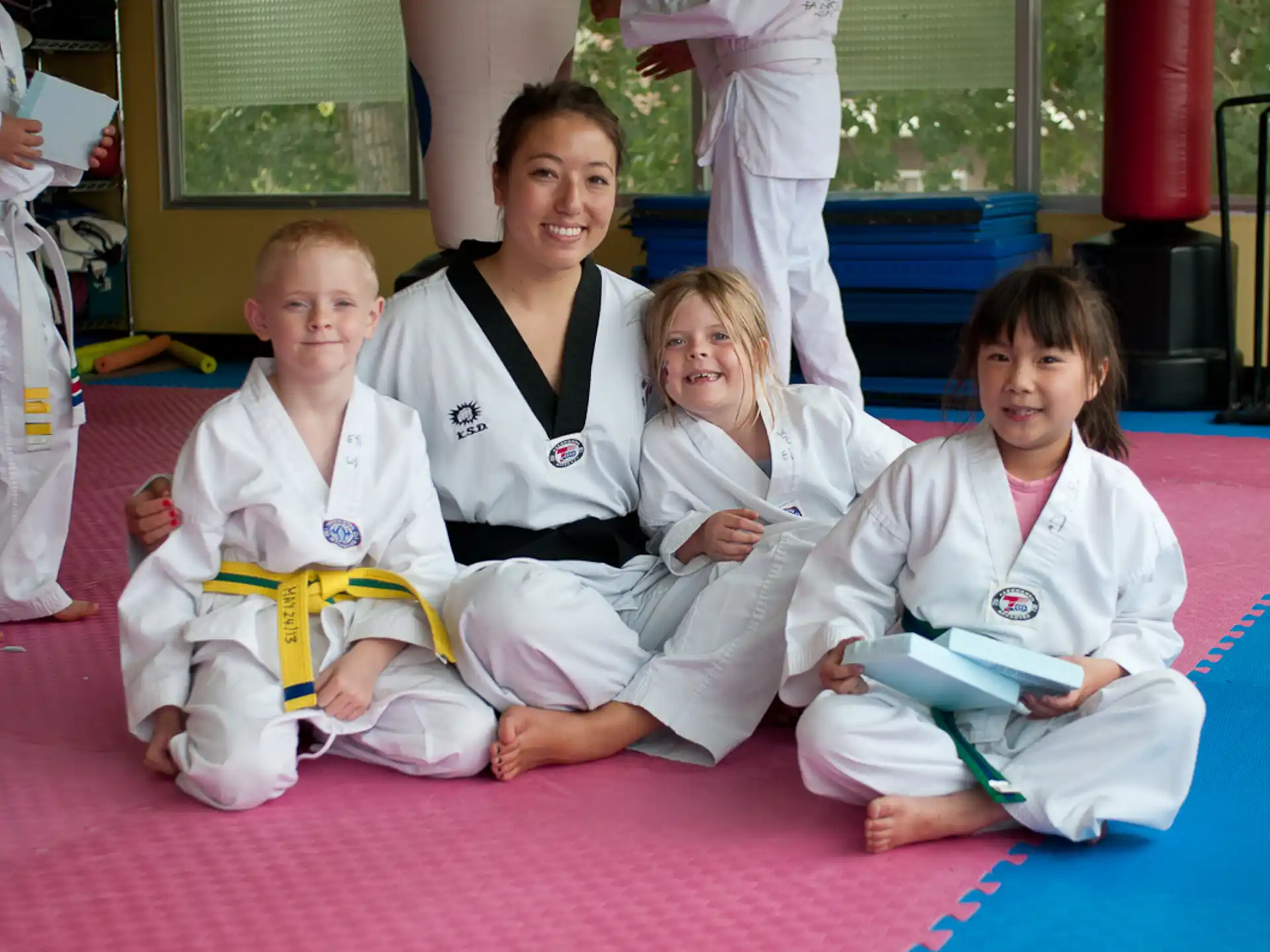 a group of people in karate uniforms