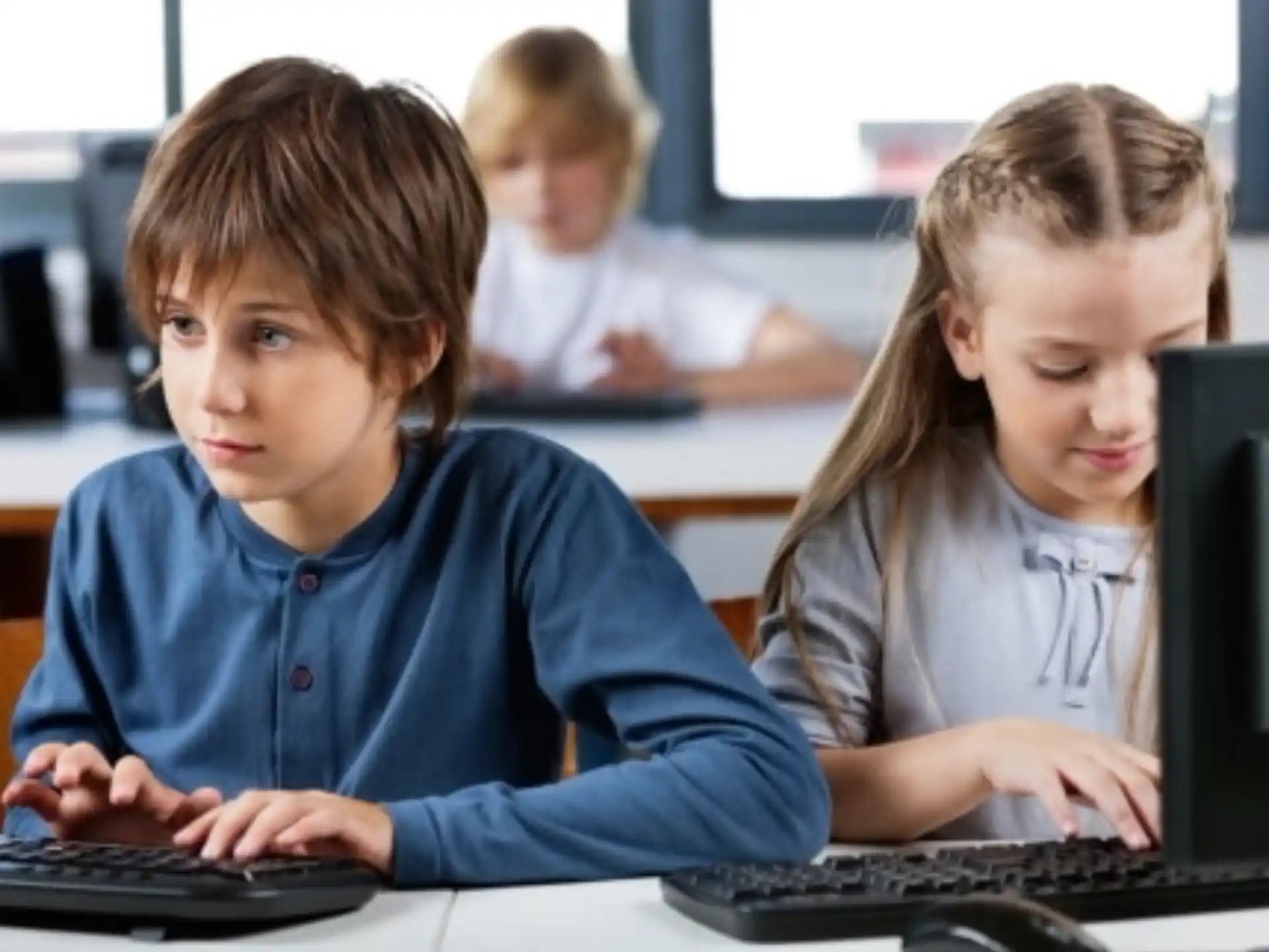 a few children working on computers