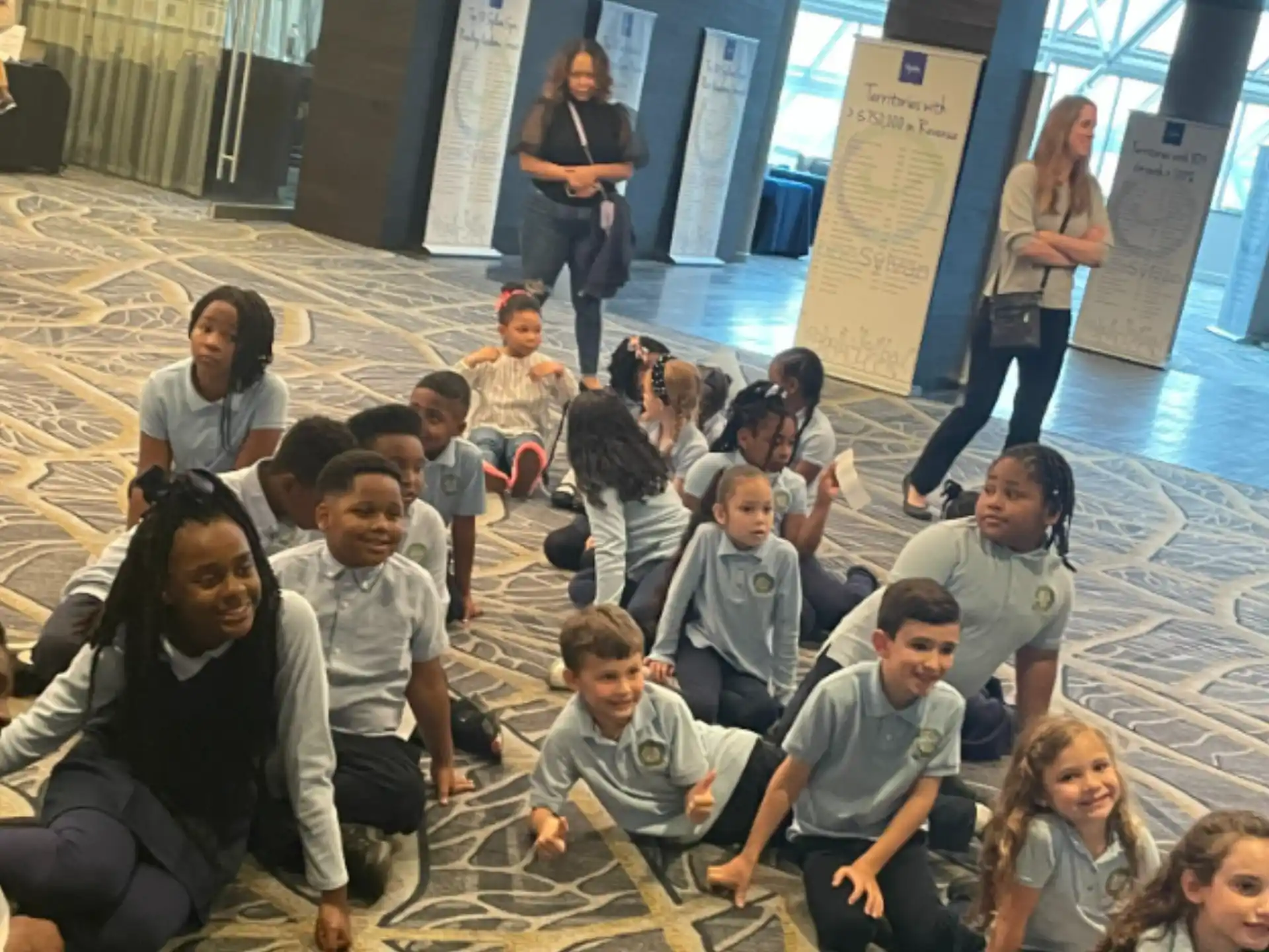 a group of people sitting on the floor