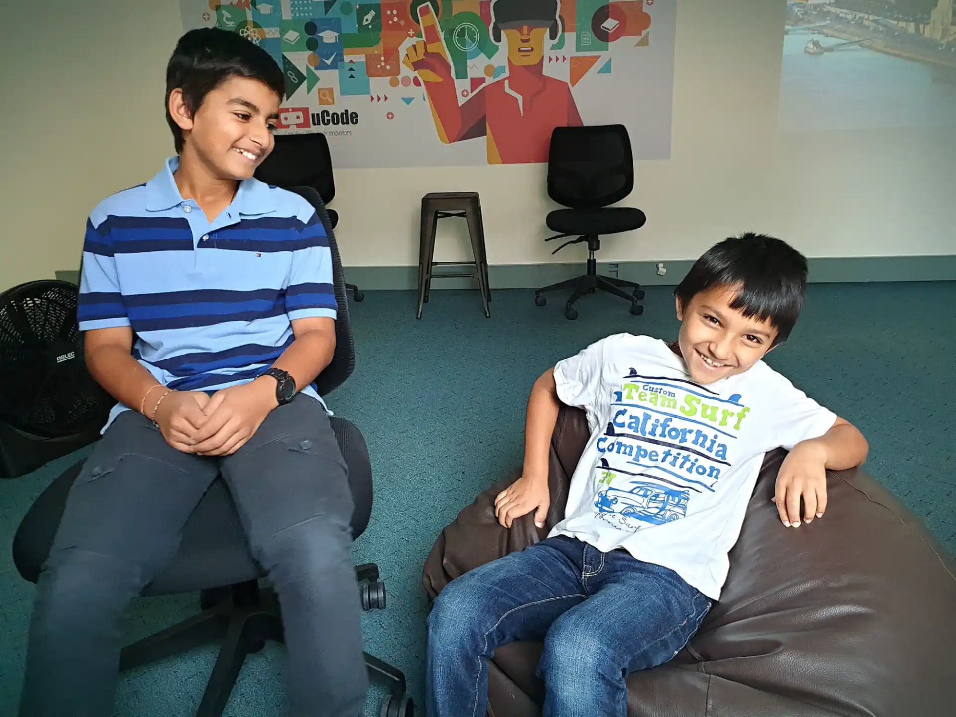 a person and a boy sitting on a couch