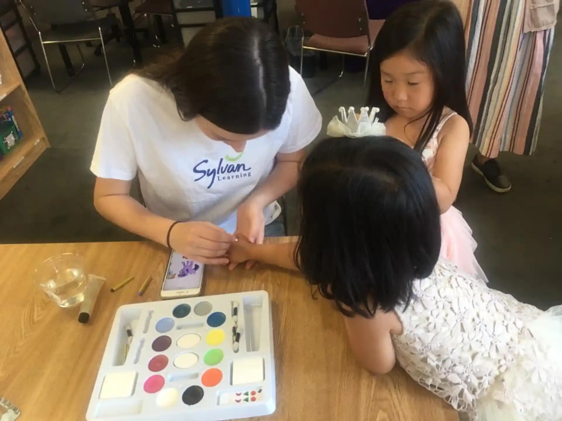 a group of people playing a board game