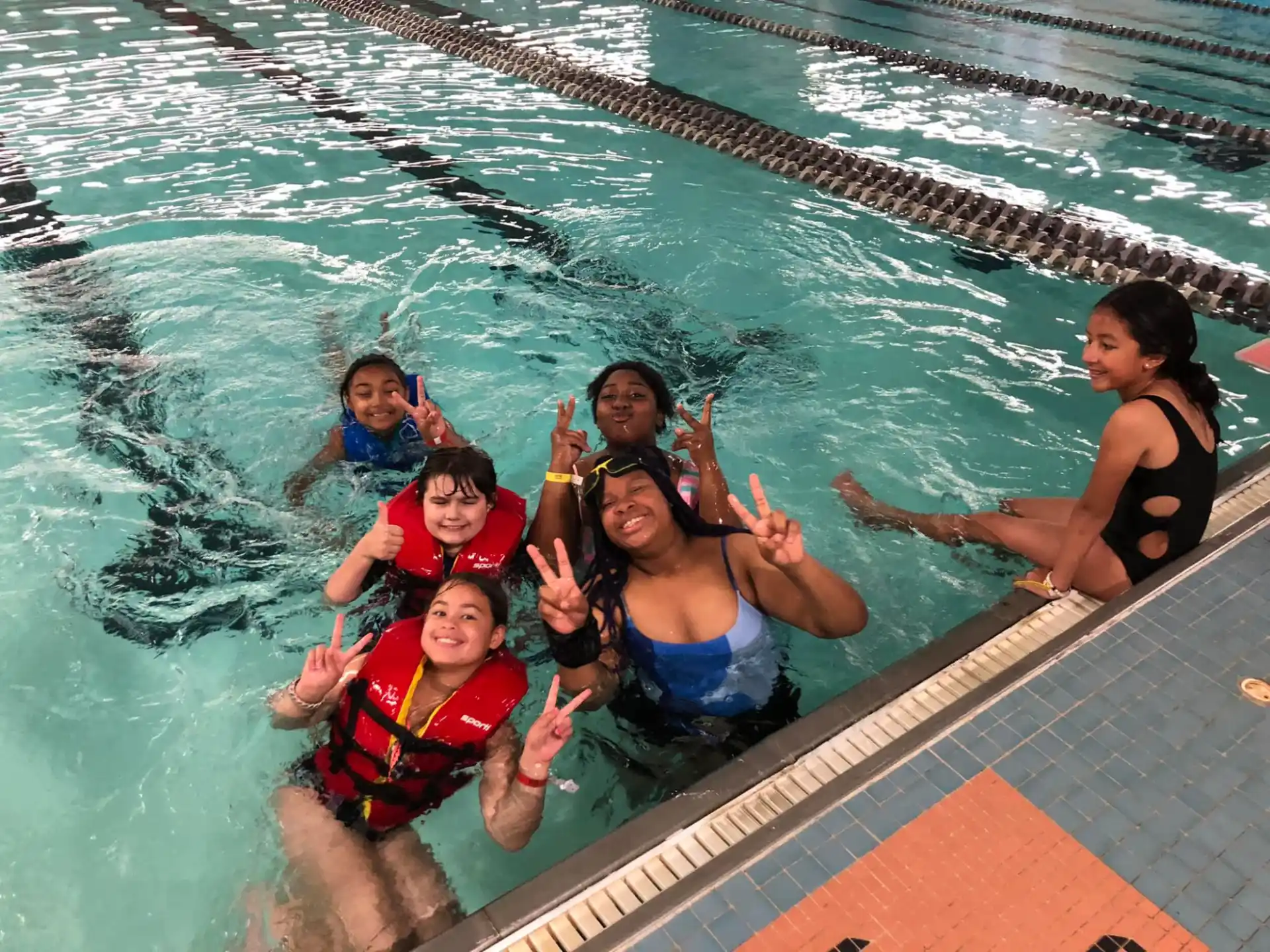 a group of people in a pool