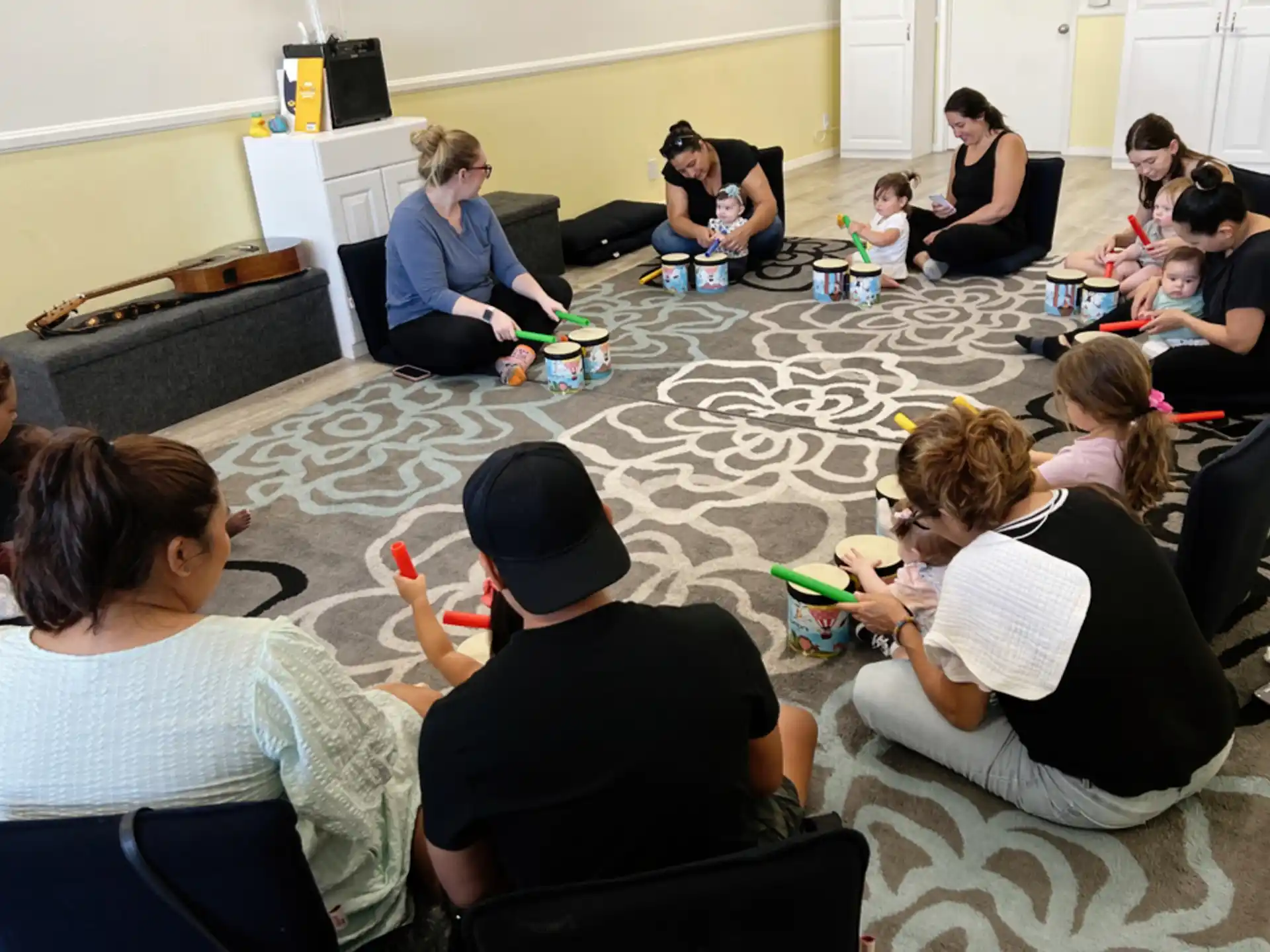 a group of people sitting on the floor