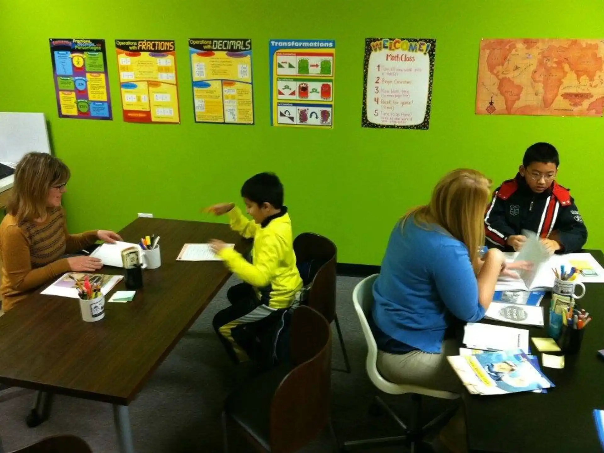 a group of people sitting at a table