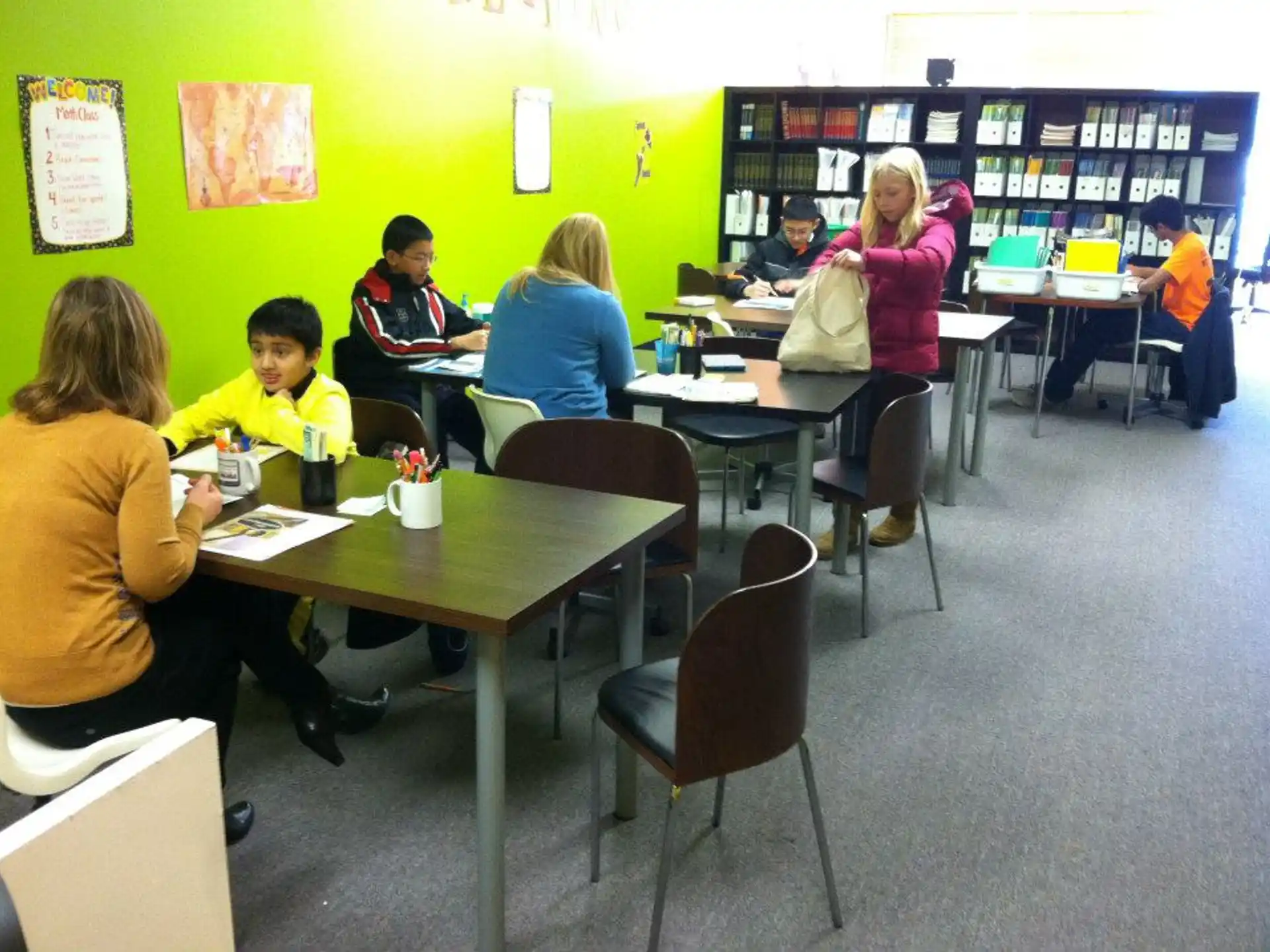 a group of people sitting at tables