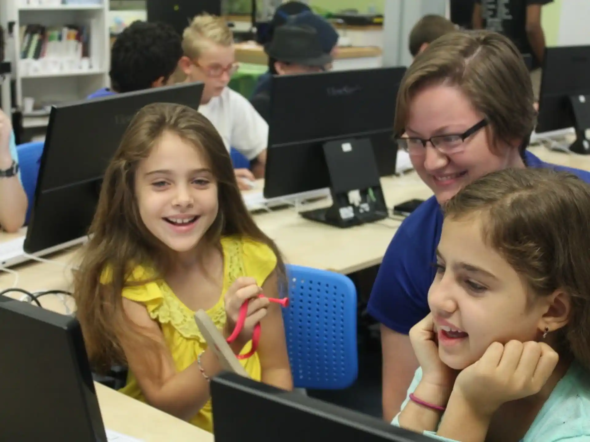 a group of people sitting at computers
