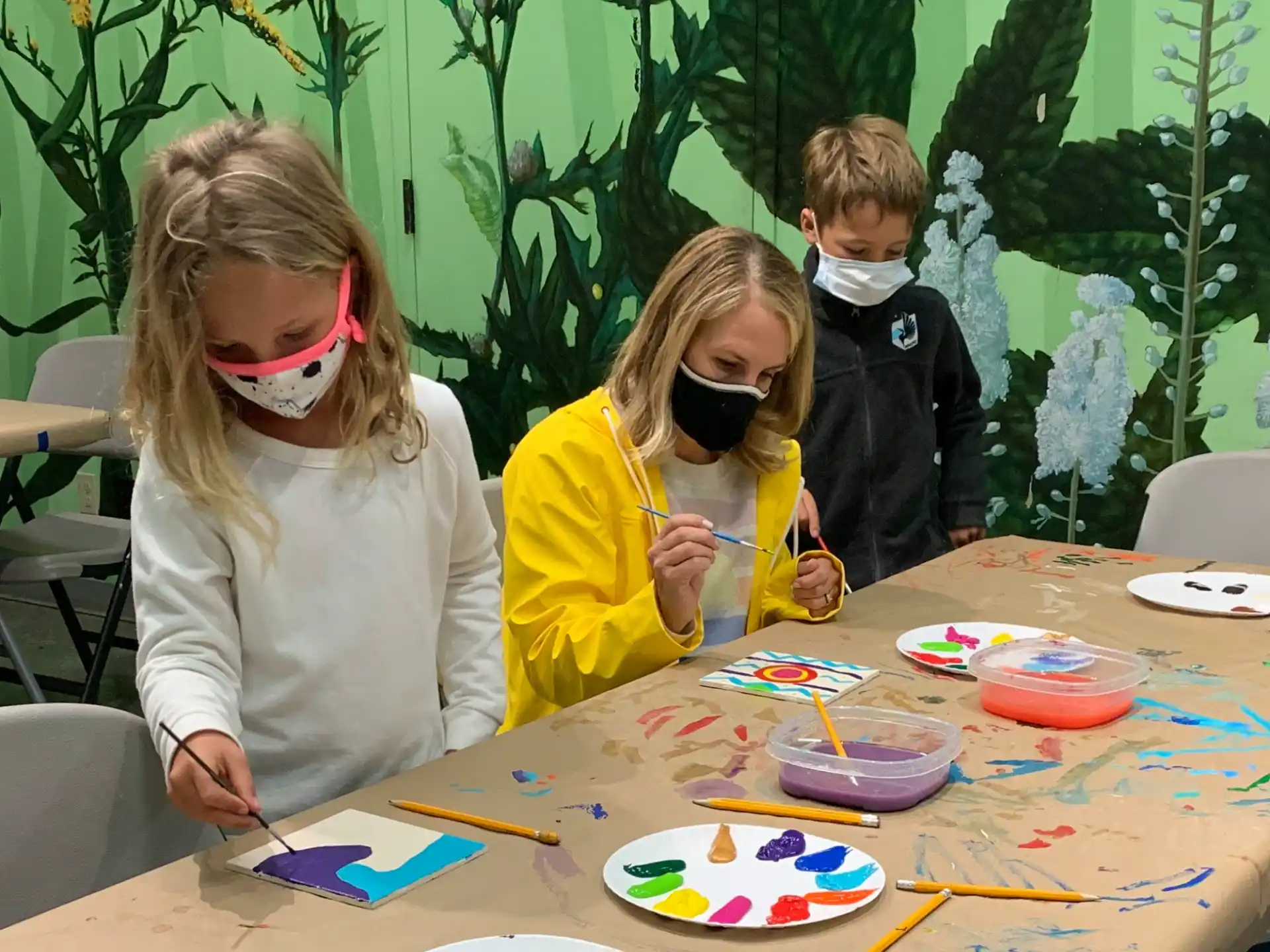 a group of children wearing masks