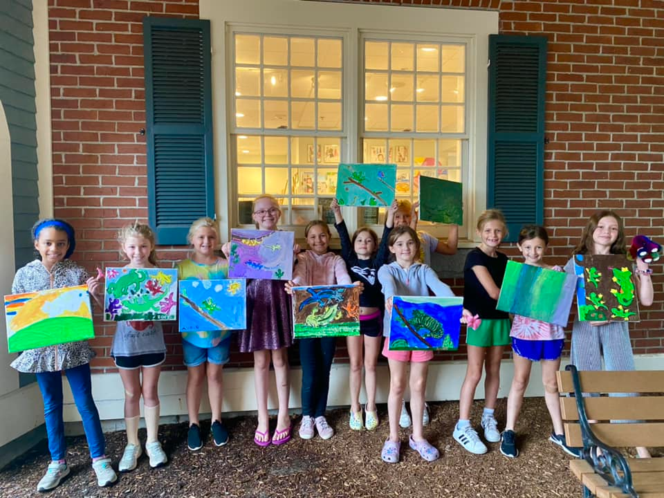a group of children holding signs