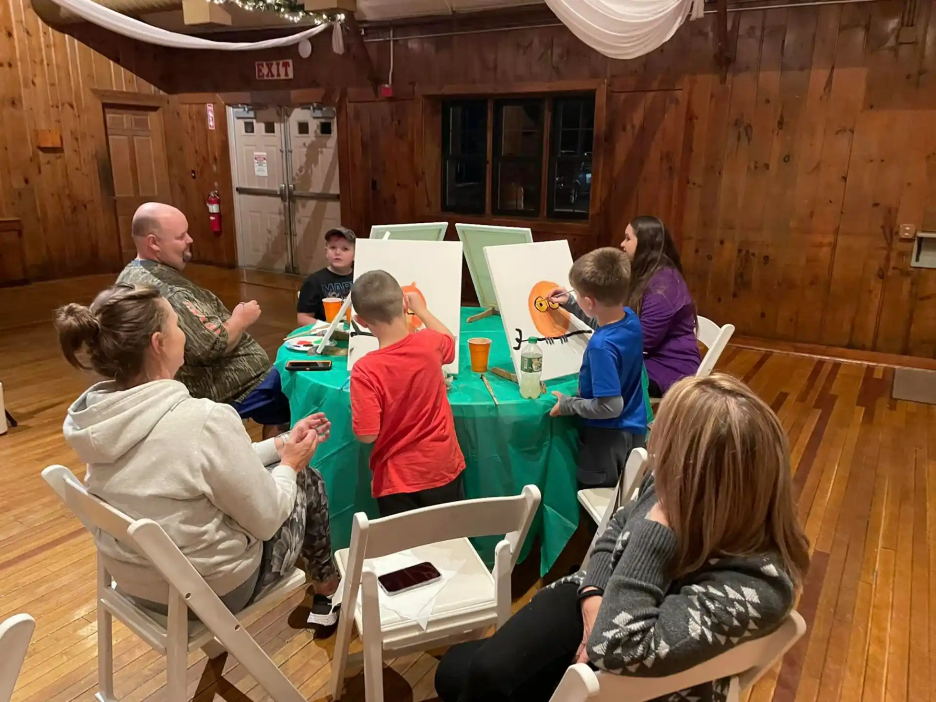 a group of people sitting around a table