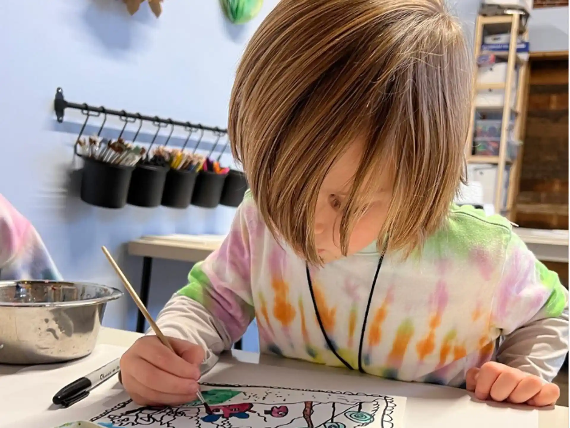a young girl painting