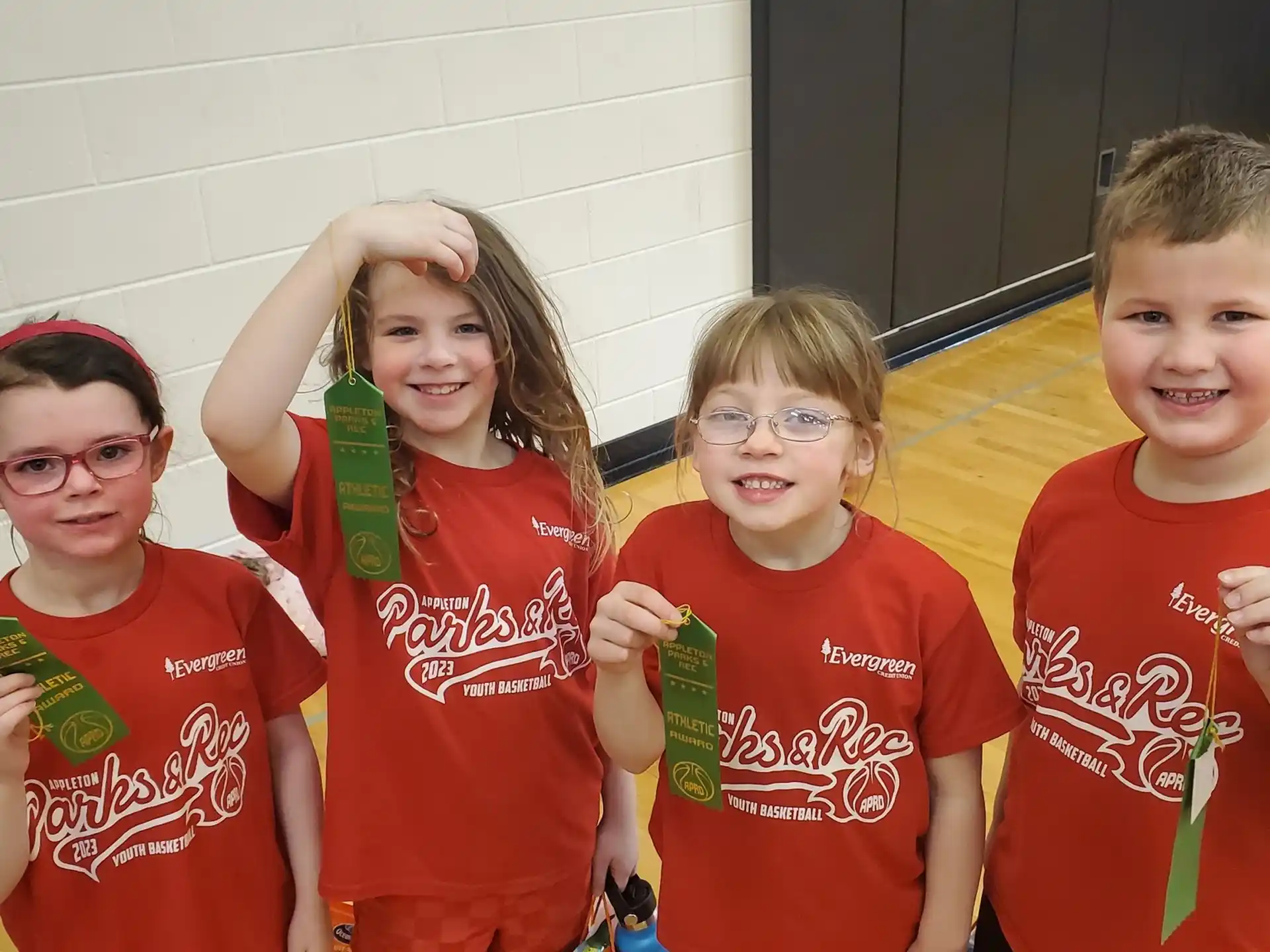 a group of kids wearing matching t-shirts