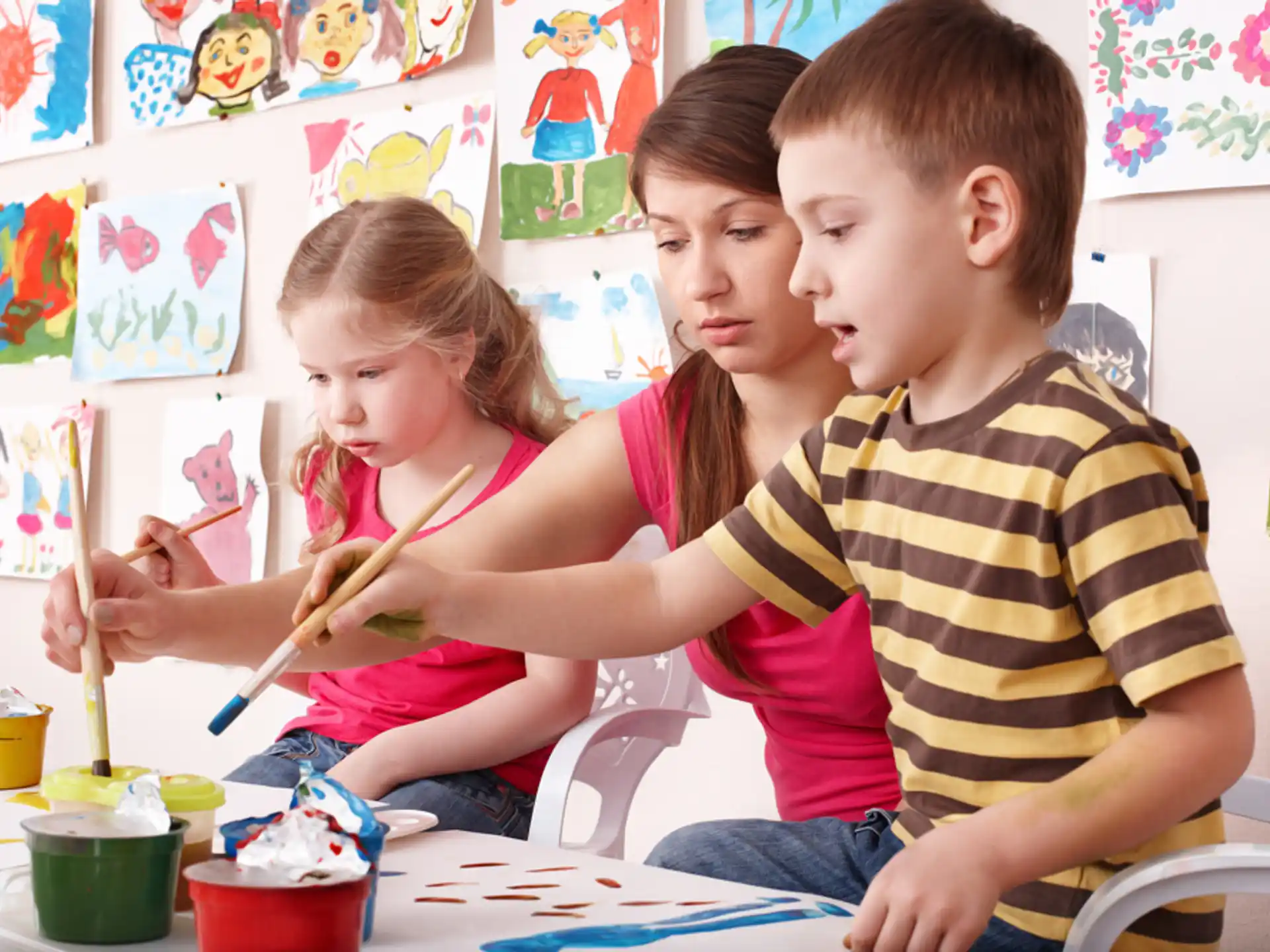 a group of children painting
