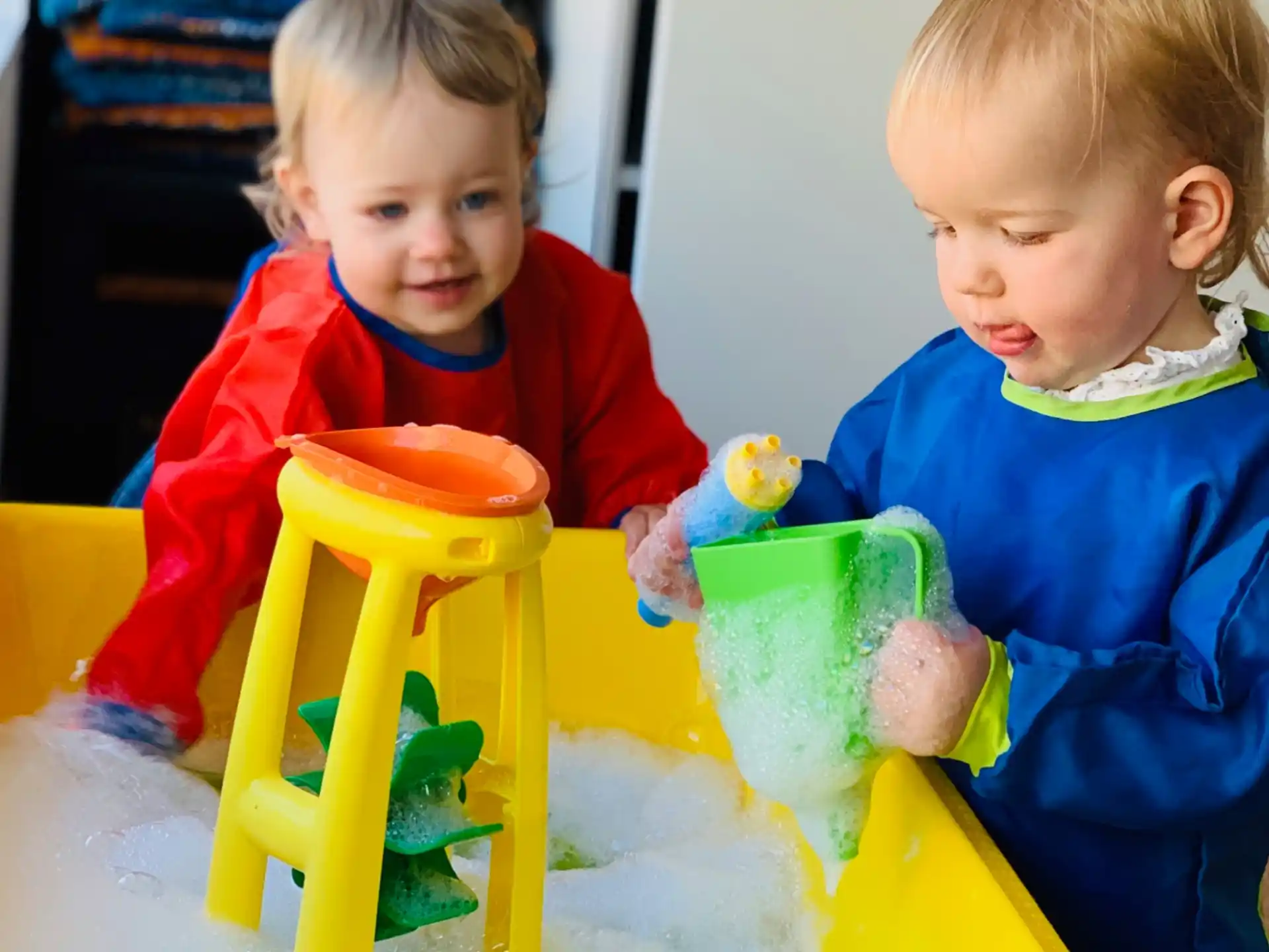 two children playing with toys
