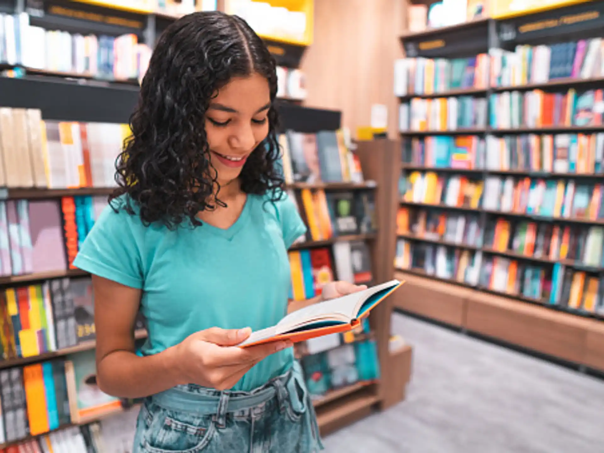 a person reading a book in a library