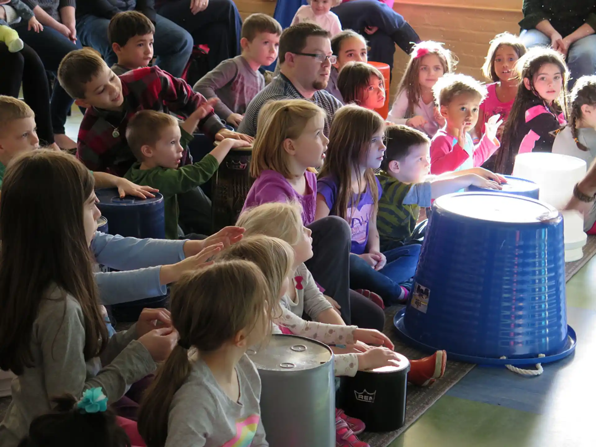 a group of children sitting in a circle