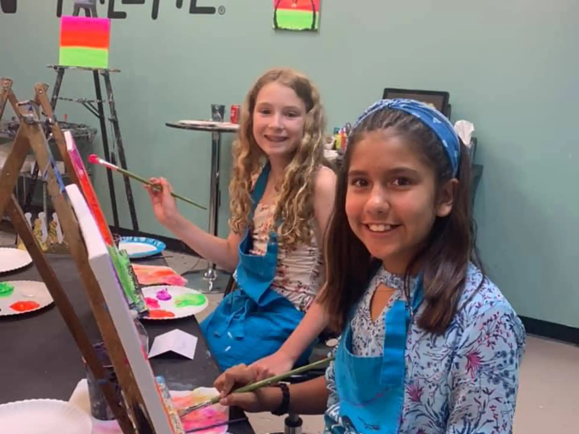 a couple of girls painting