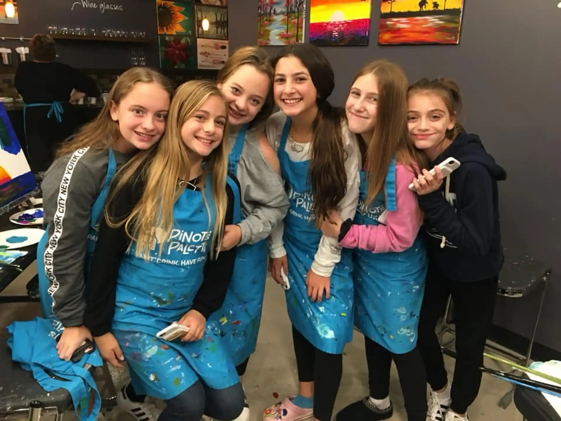 a group of girls posing for a picture