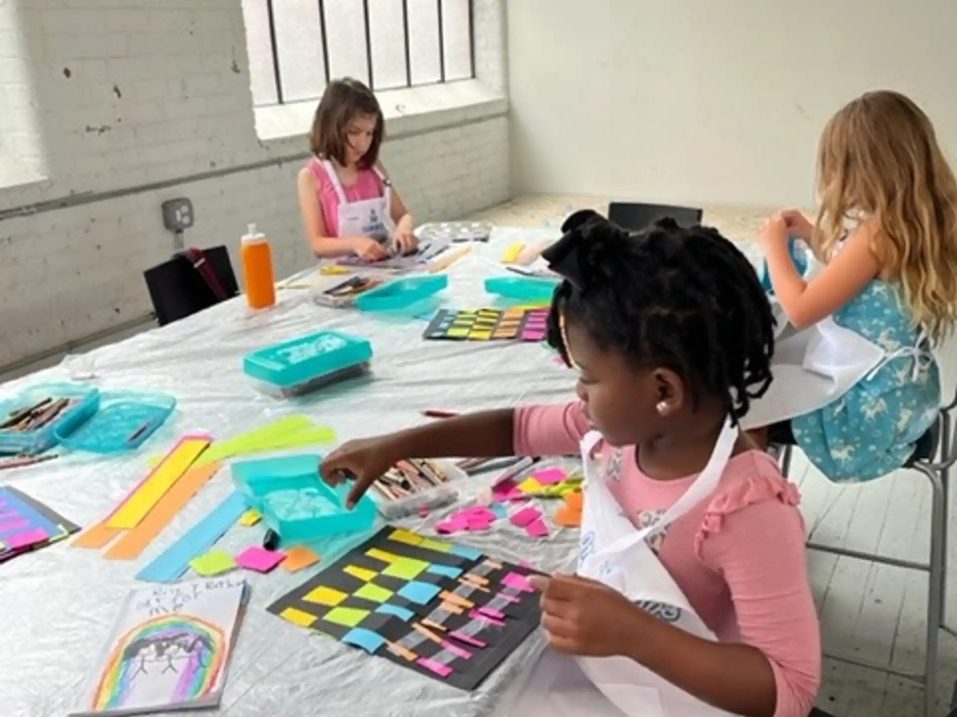 a group of children painting