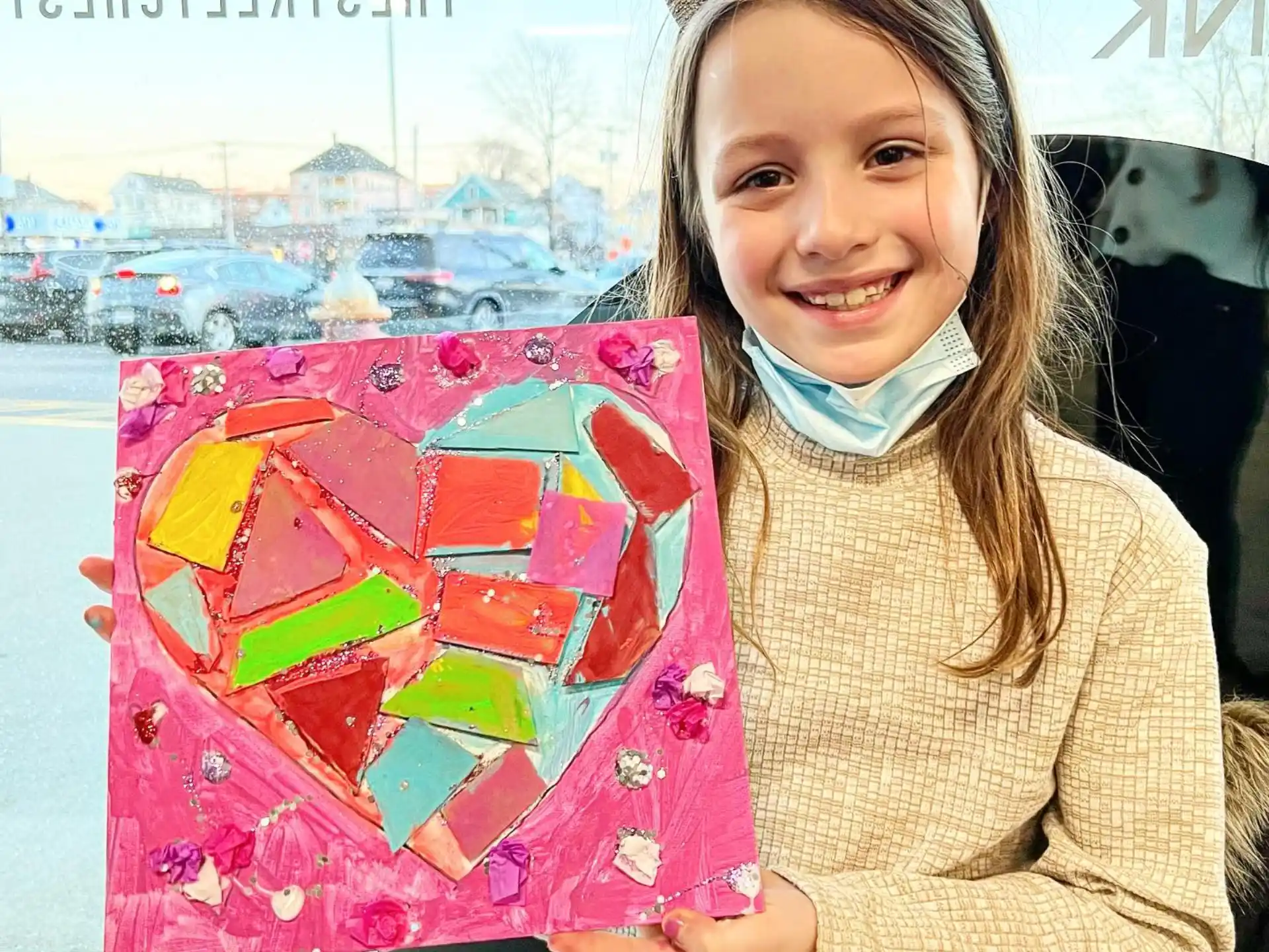 a girl holding a gift box