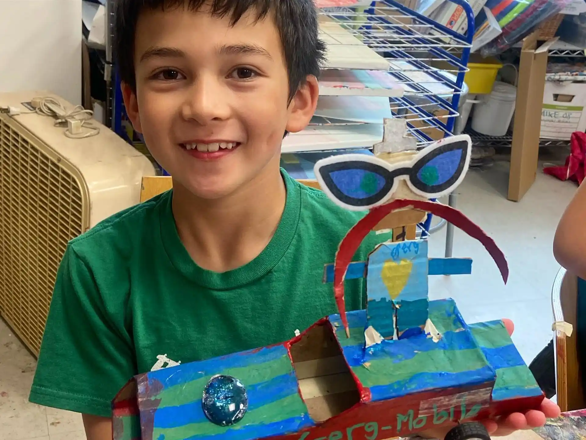 a boy holding a toy