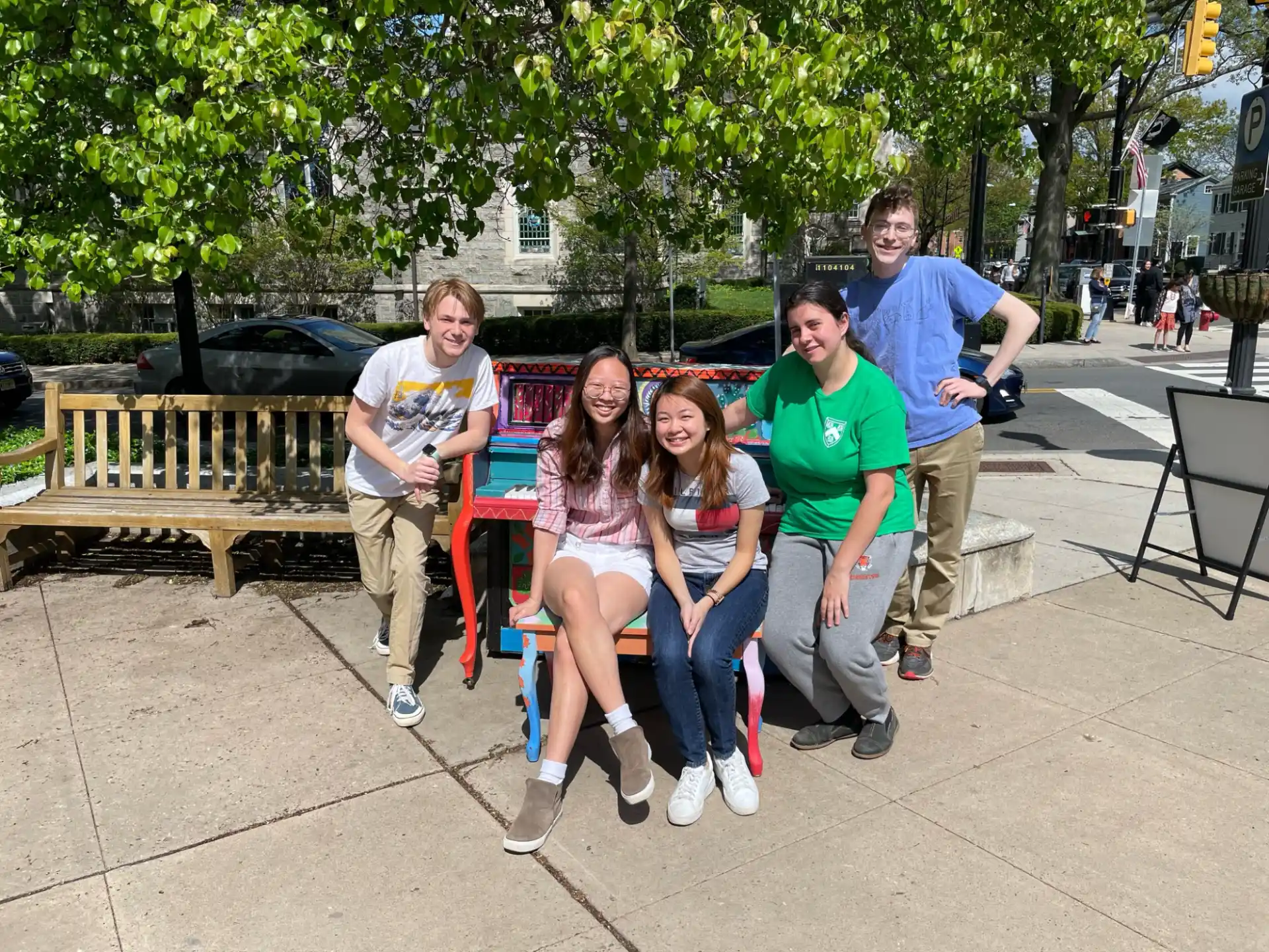 a group of people sitting on a bench