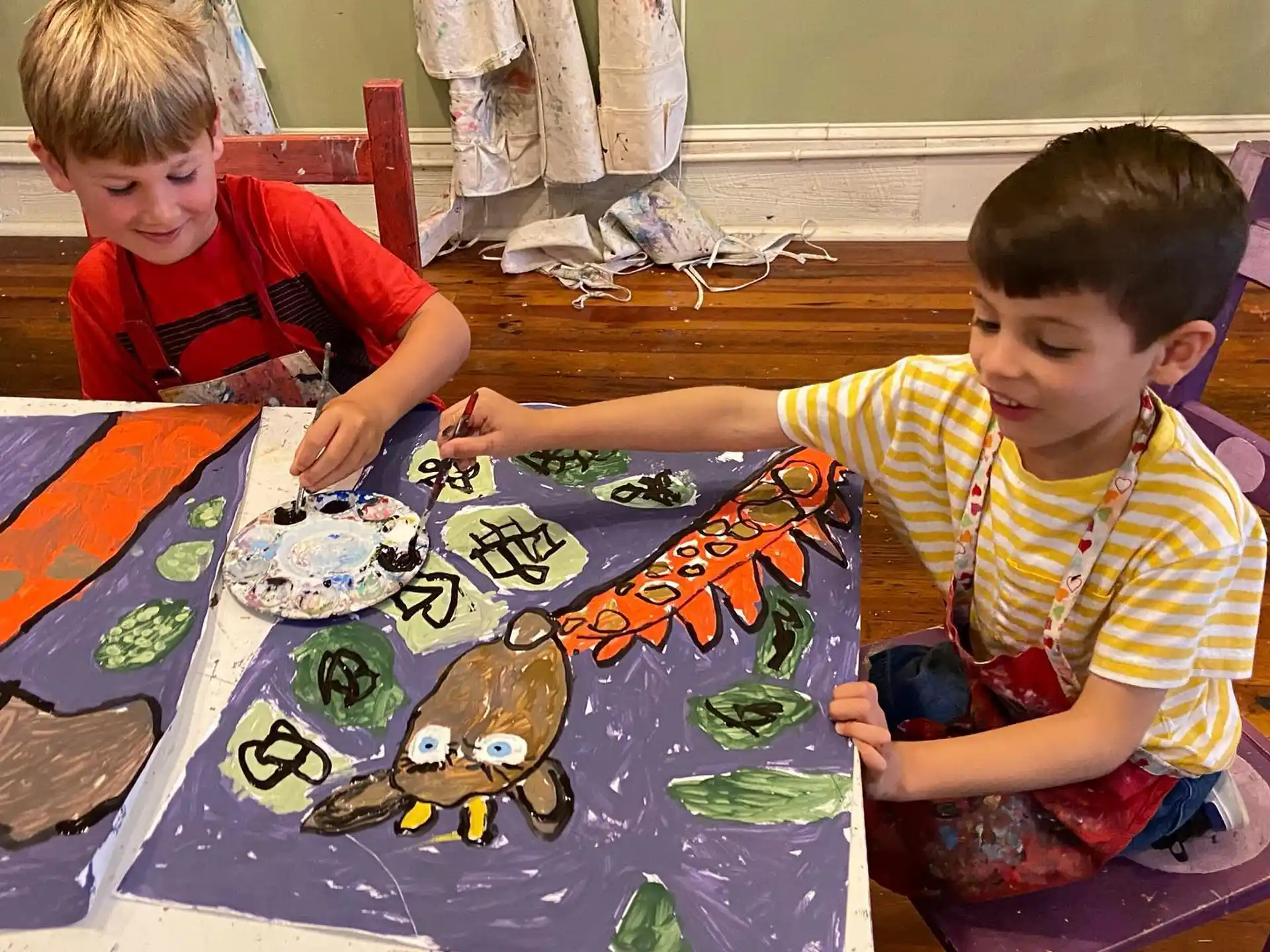 a couple of boys painting