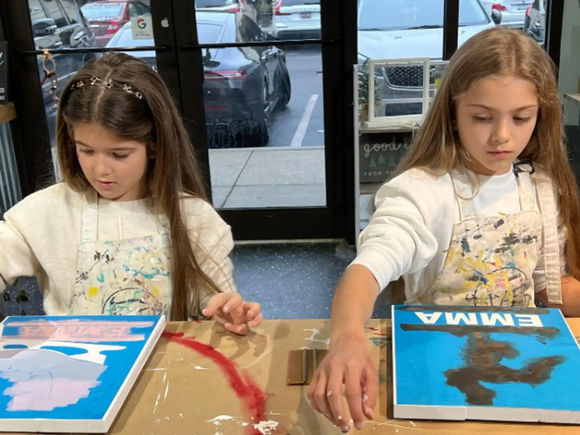 a couple of young girls painting