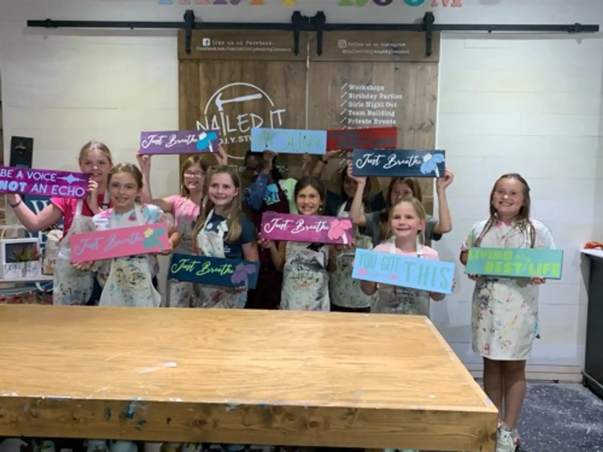 a group of children holding signs