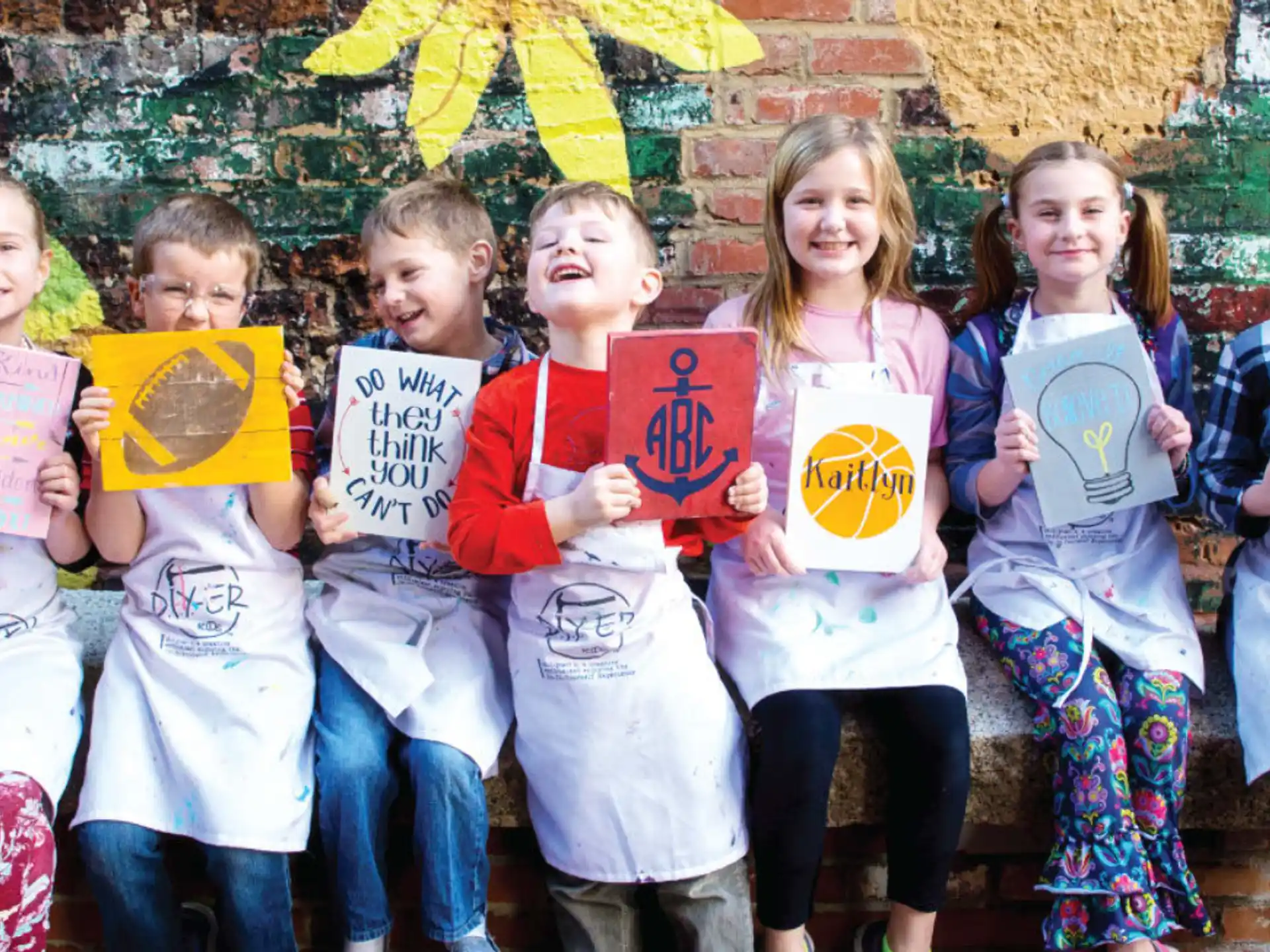 a group of children holding signs