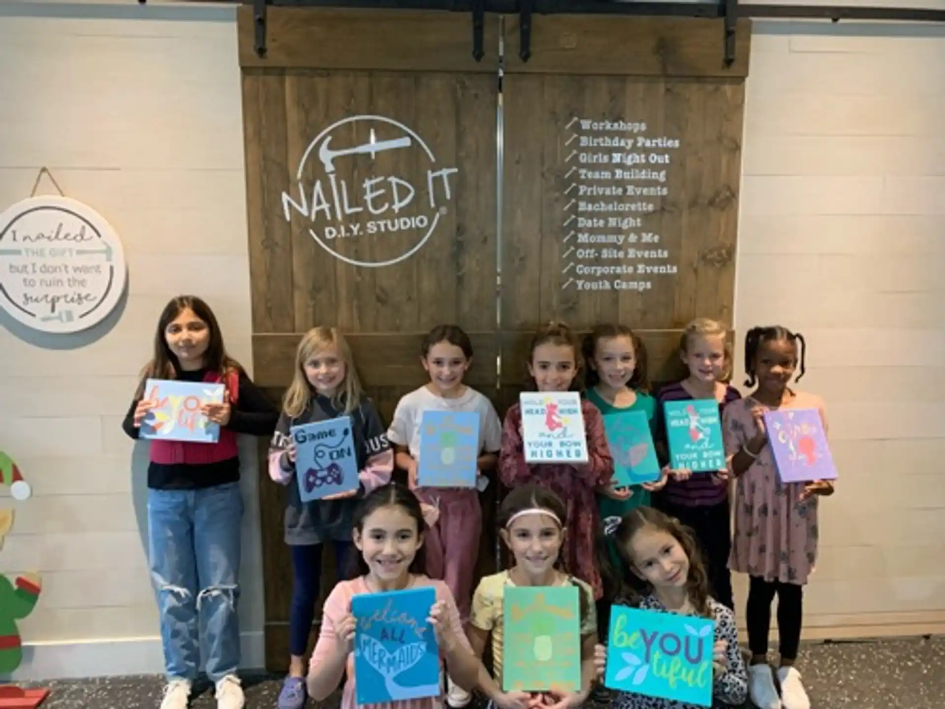 a group of children holding signs