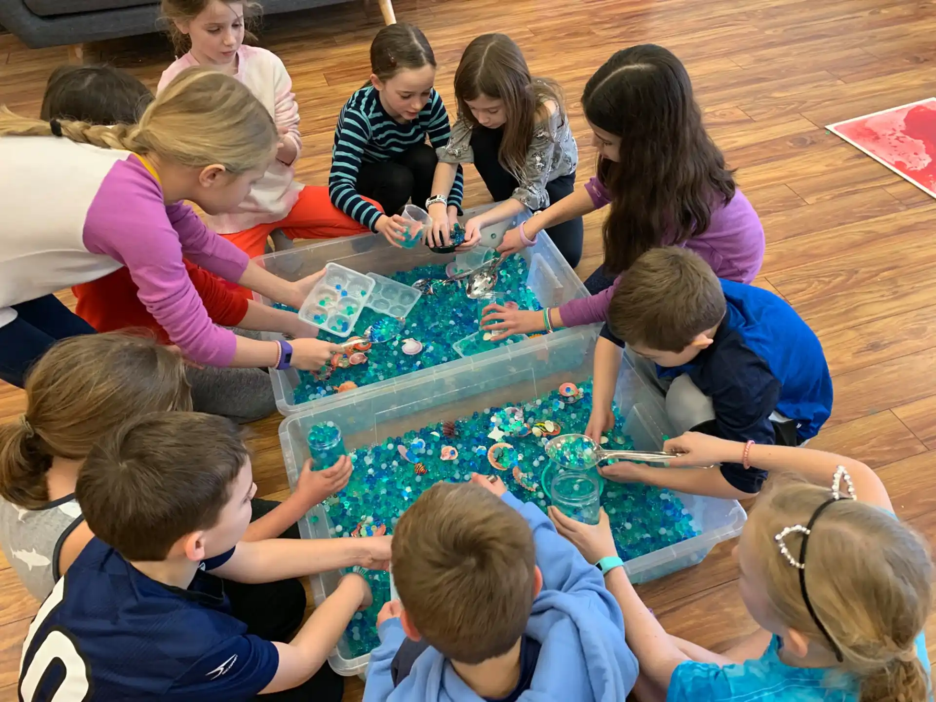 a group of children playing with a toy