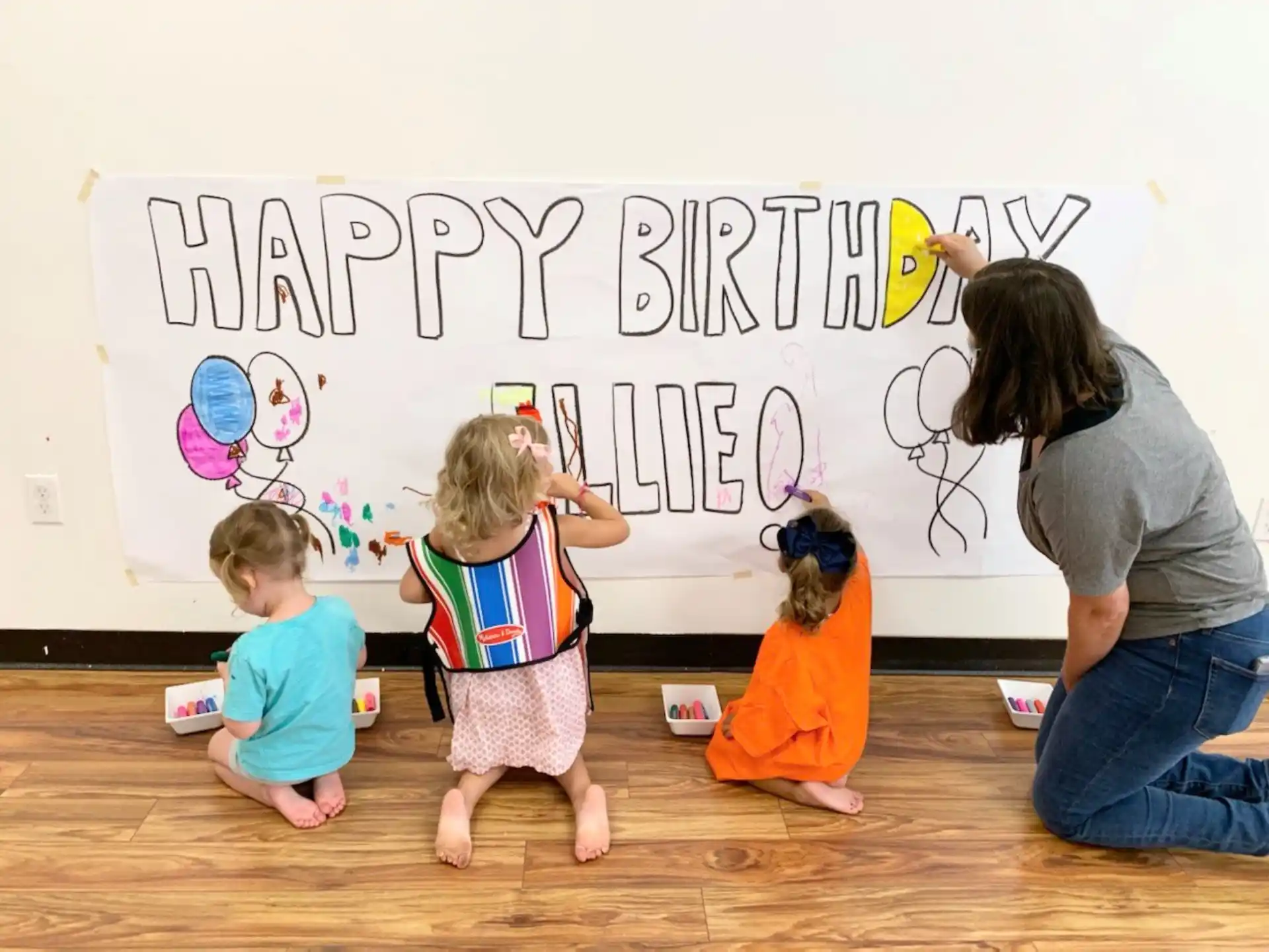 a person and children painting