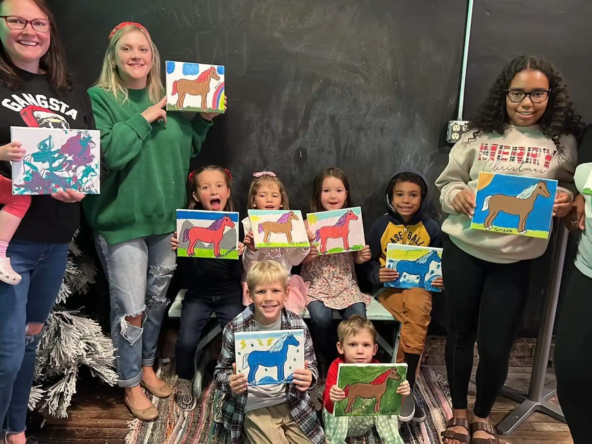 a group of children holding boxes