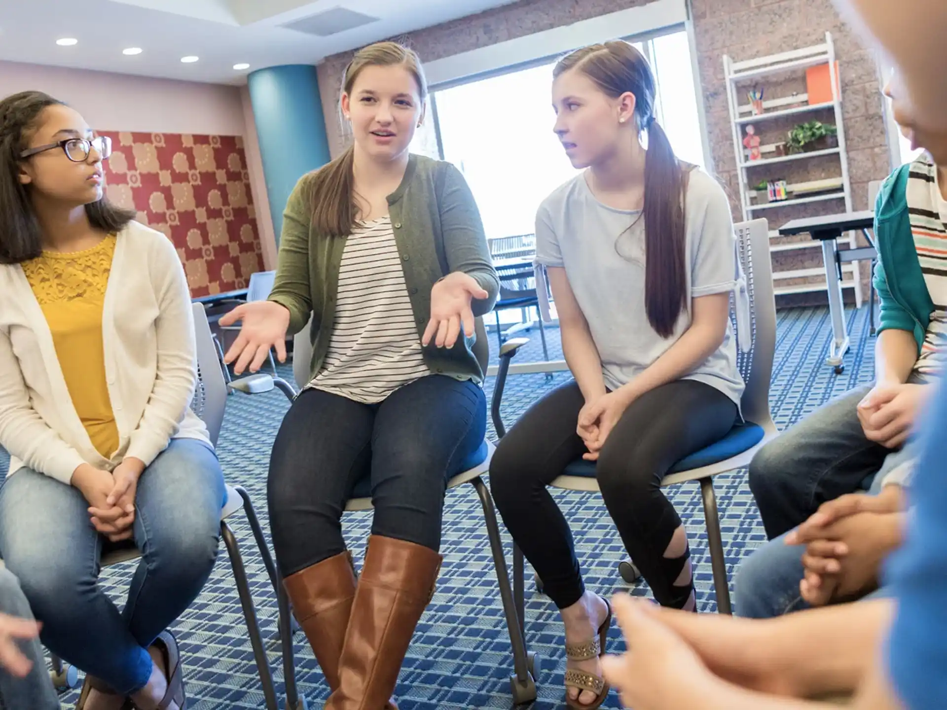 a group of women sitting in chairs