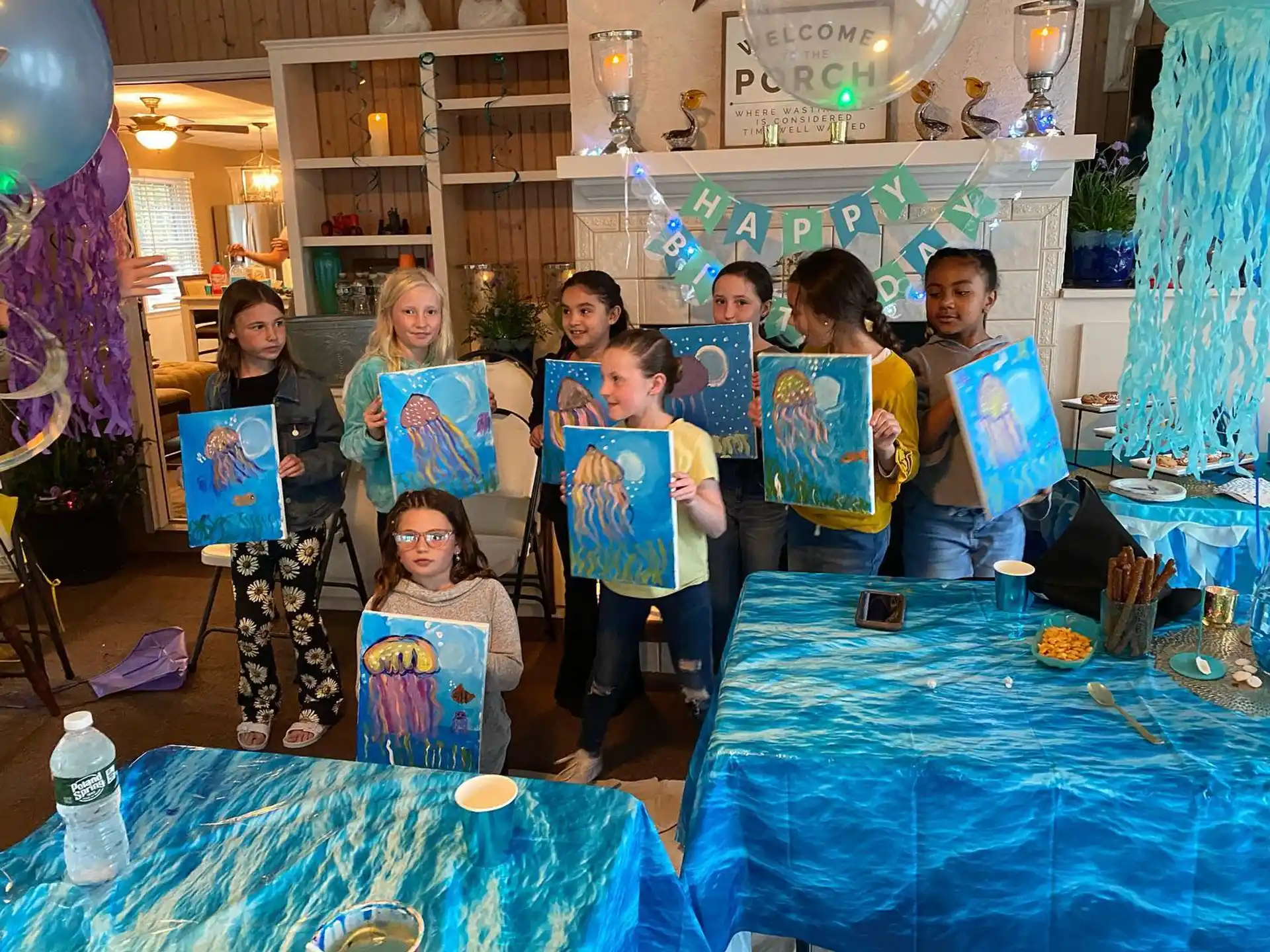 a group of children holding up posters