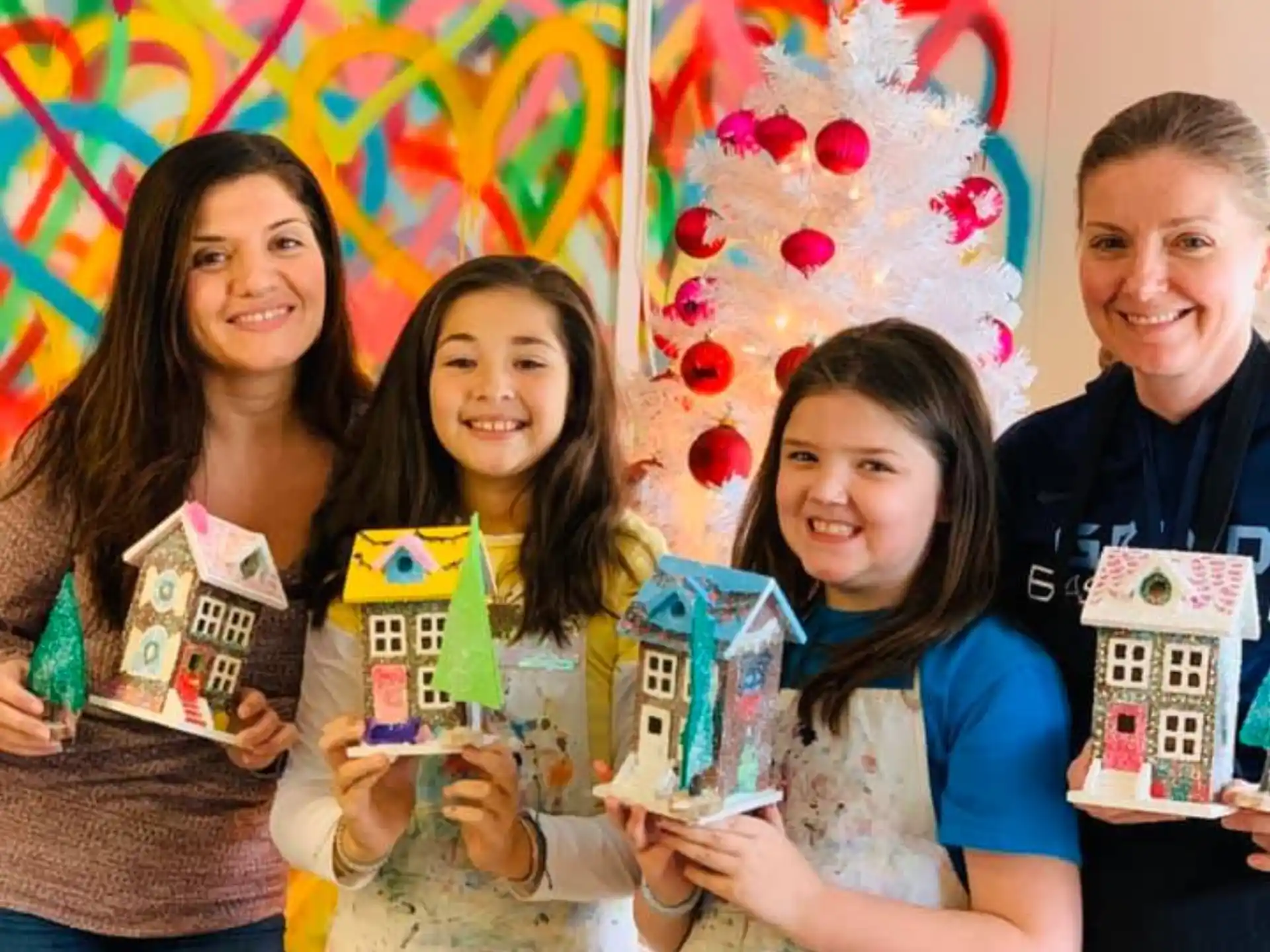 a group of people holding boxes