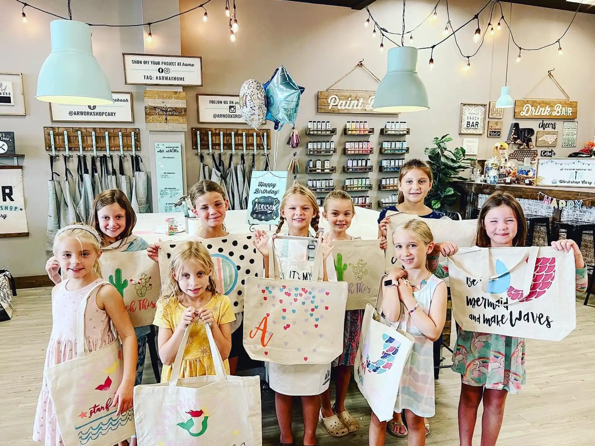 a group of children holding signs