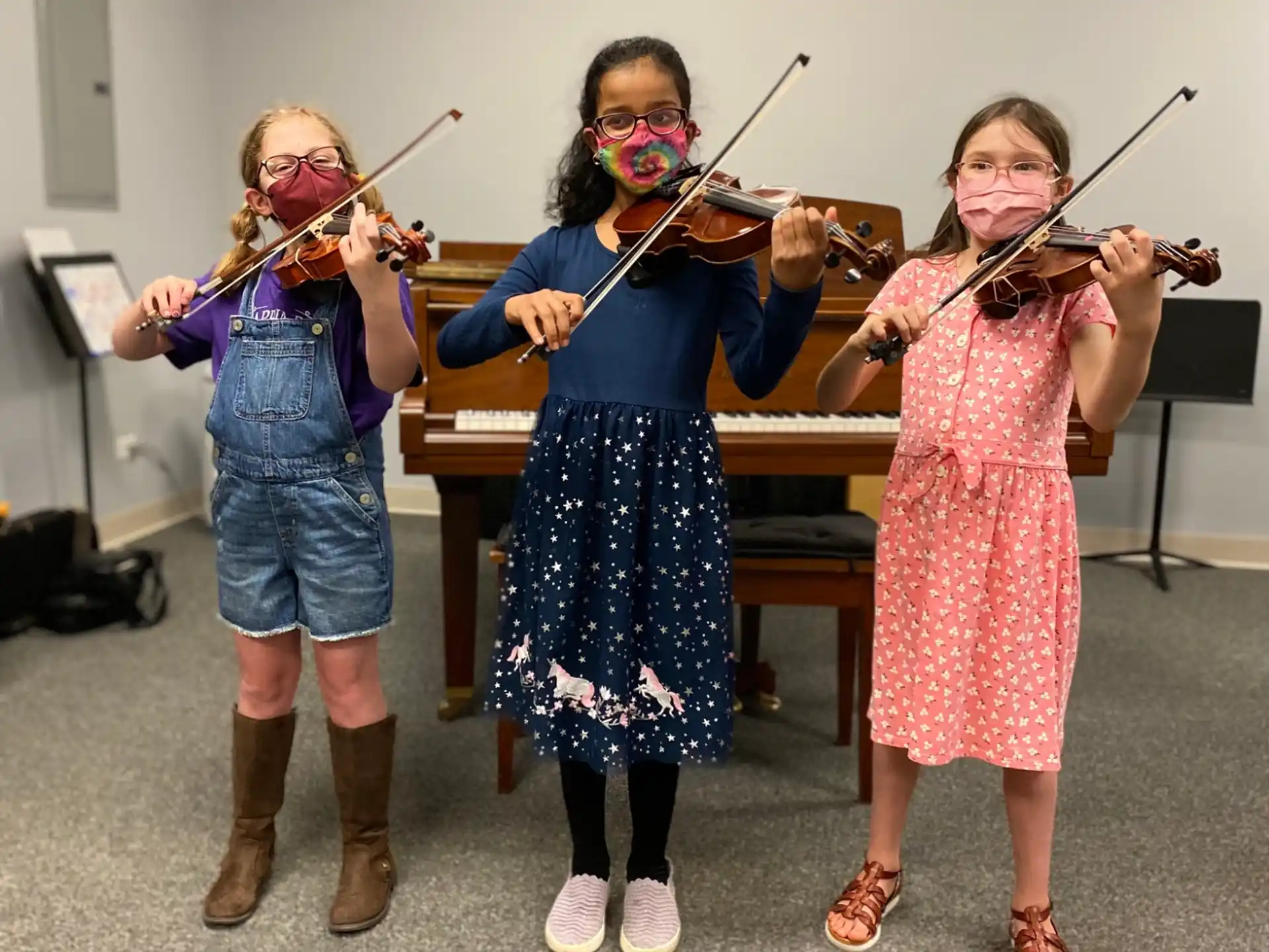 a group of people holding musical instruments